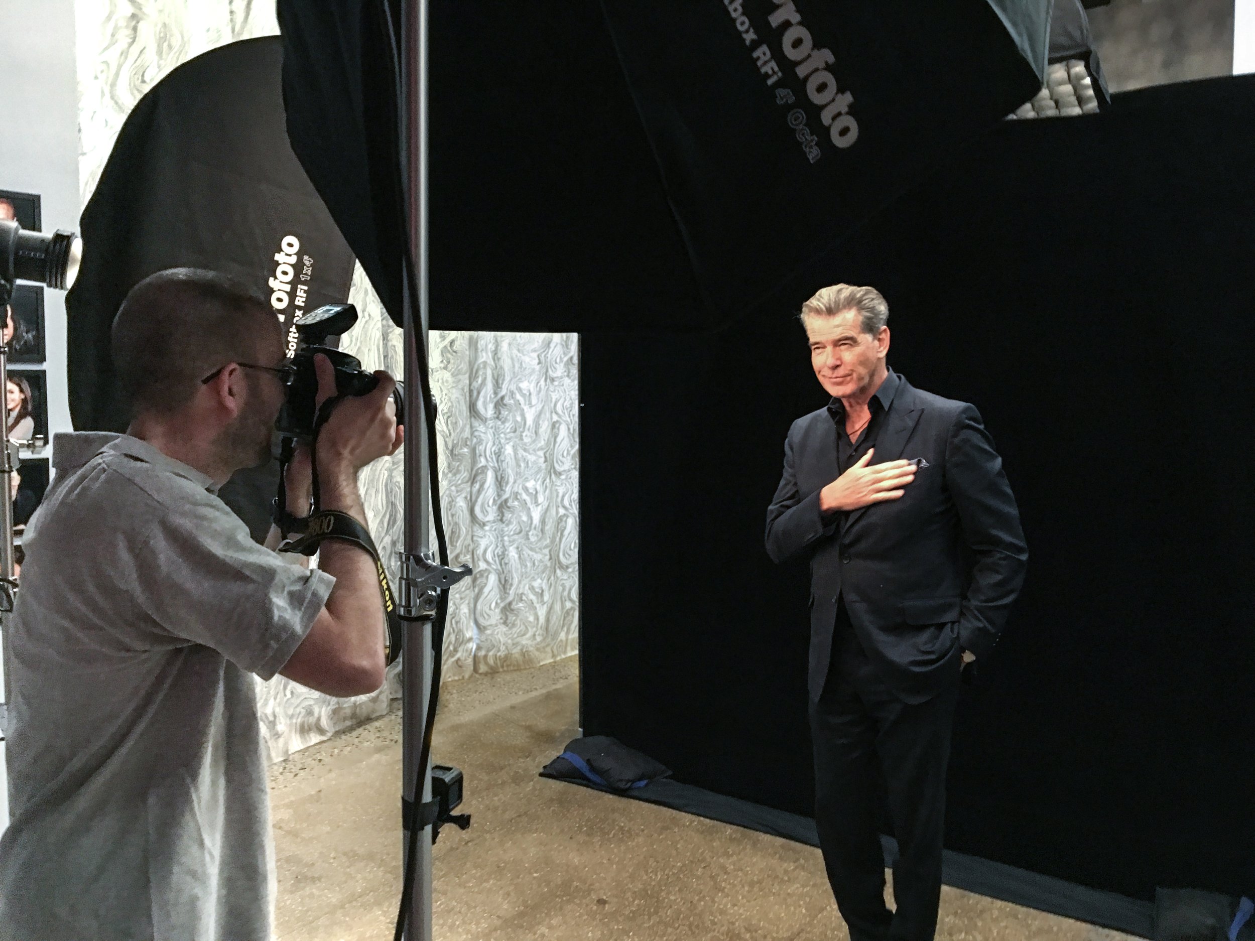 Noam Galai on set with Pierce Brosnan