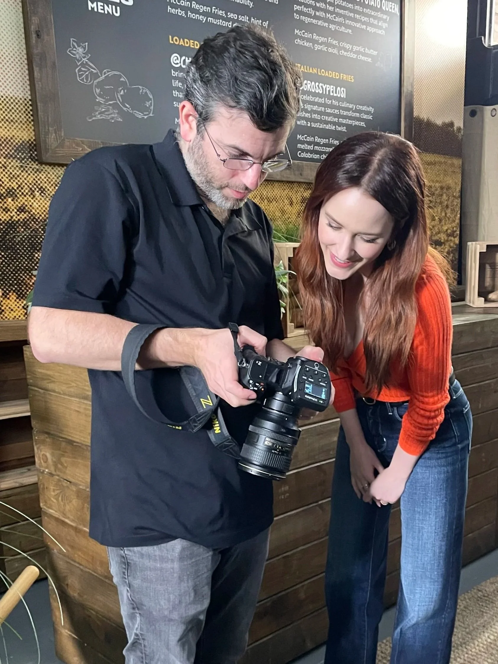 Noam Galai and Rachel Brosnahan on set for a photoshoot