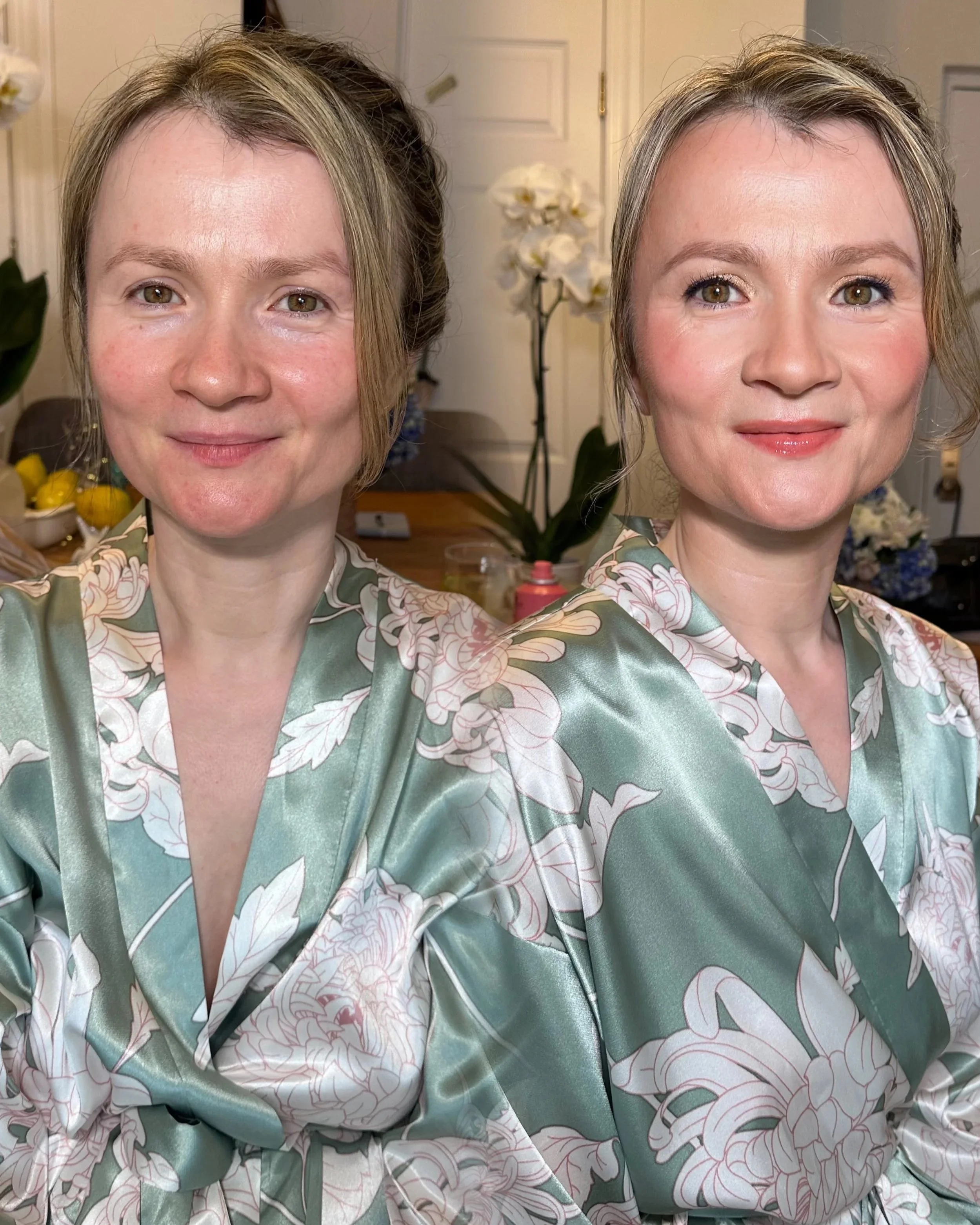 Two women wearing matching green satin robes with floral patterns, smiling in an indoor setting with flowers and objects in the background.