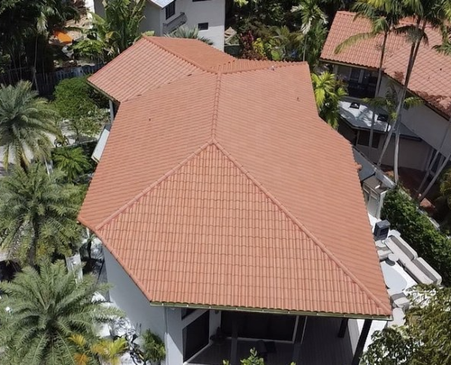Janus Roofing team performing roof inspection in South Florida