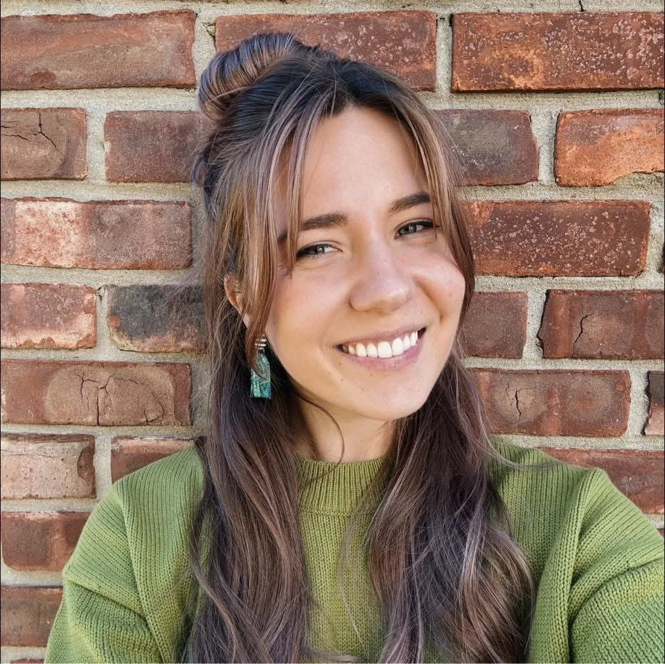 an image of Maddy Dluginski smiling at the camera