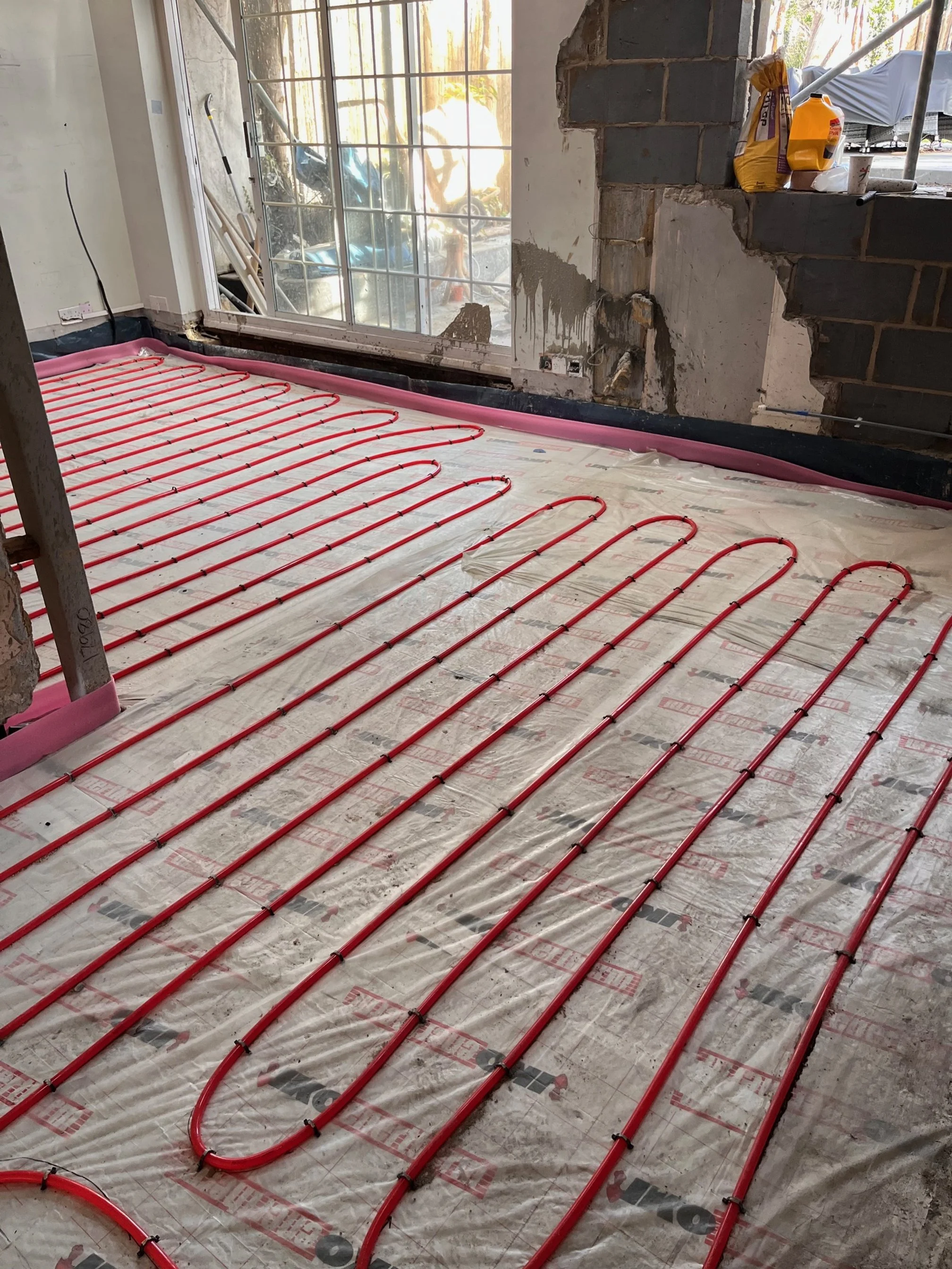 Underfloor heating installation in Bastead