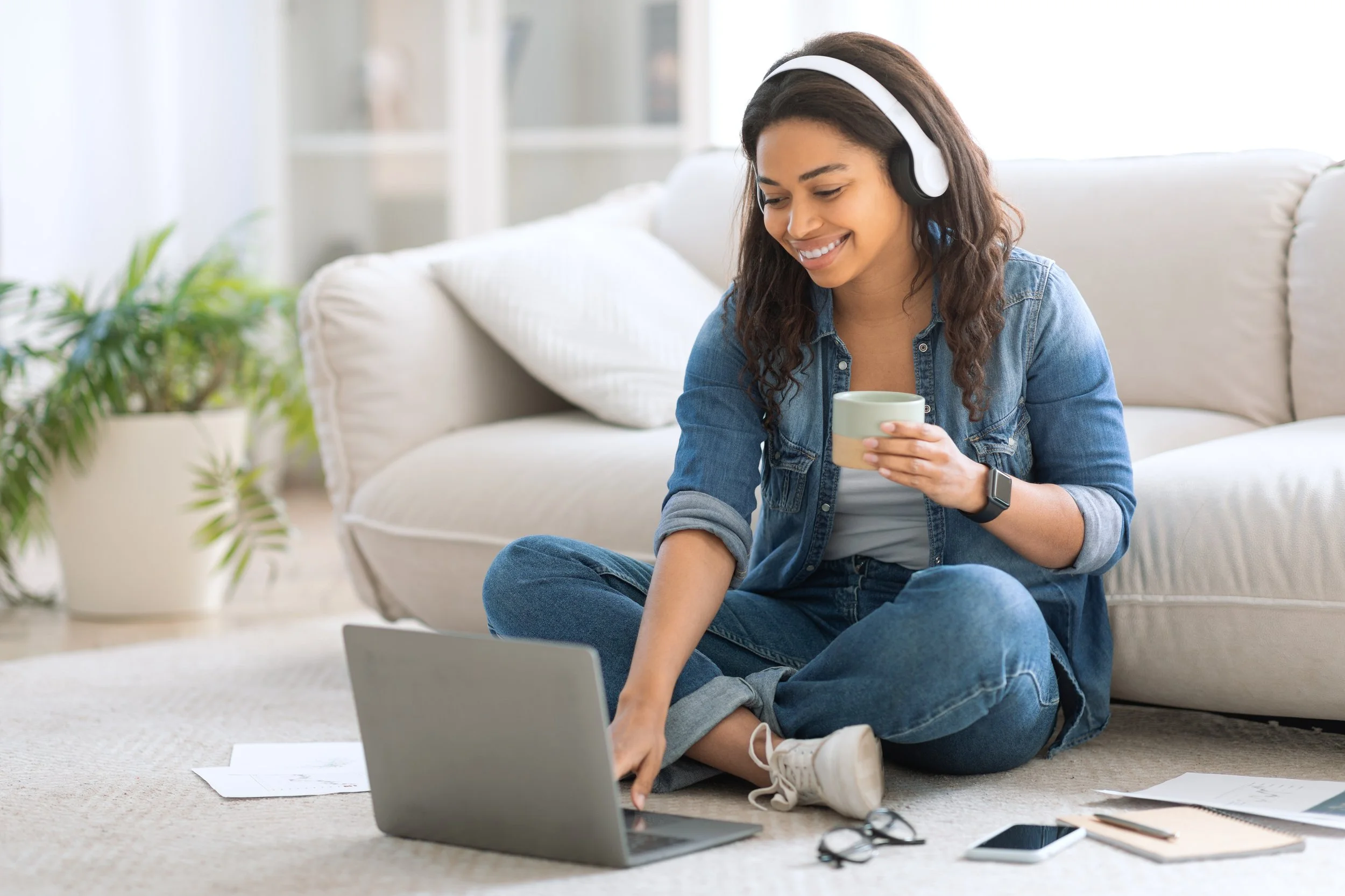 Lady working on the pc on war floors after boiler installation in Streatham