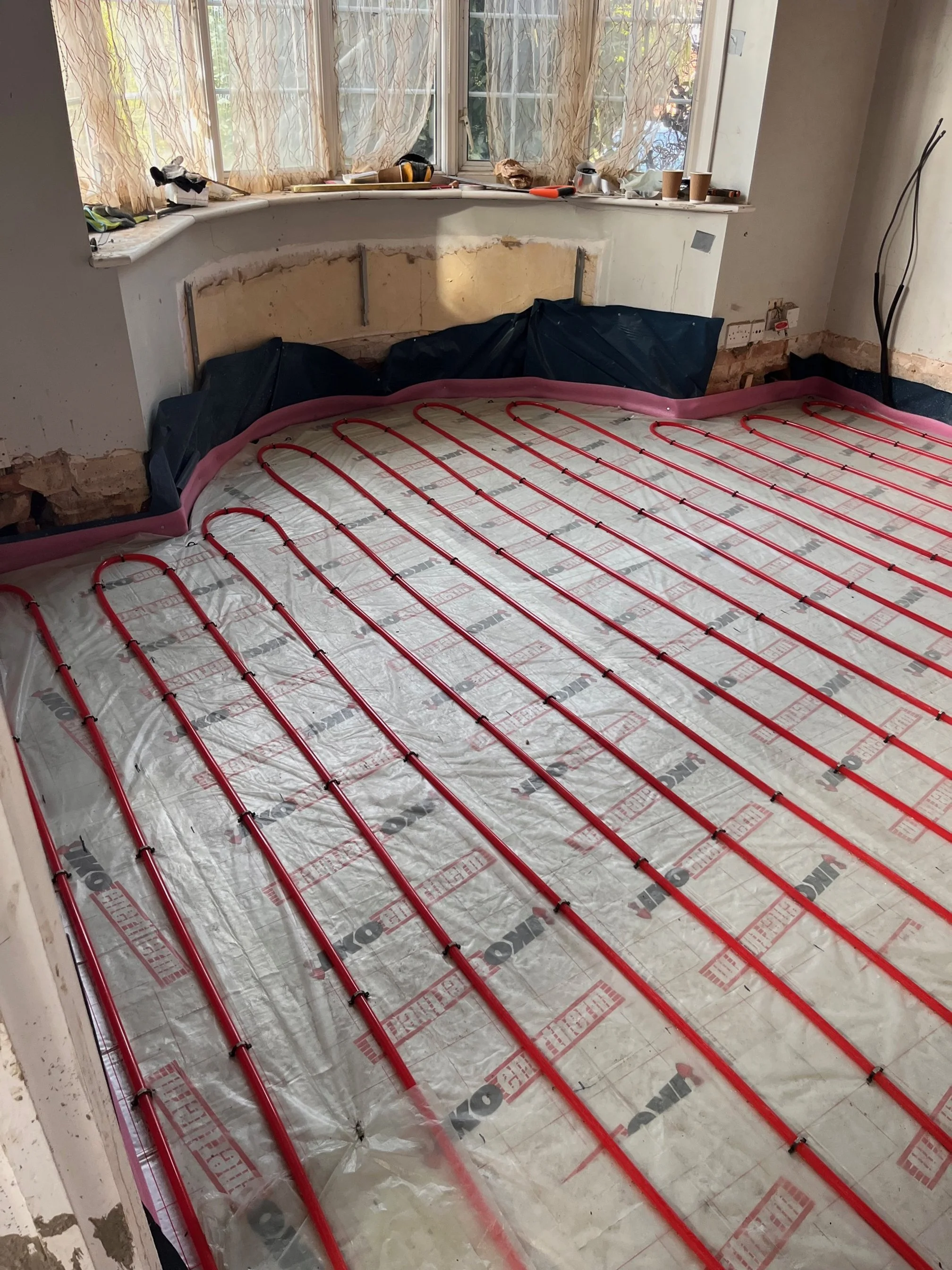Underfloor heating installation in Bastead