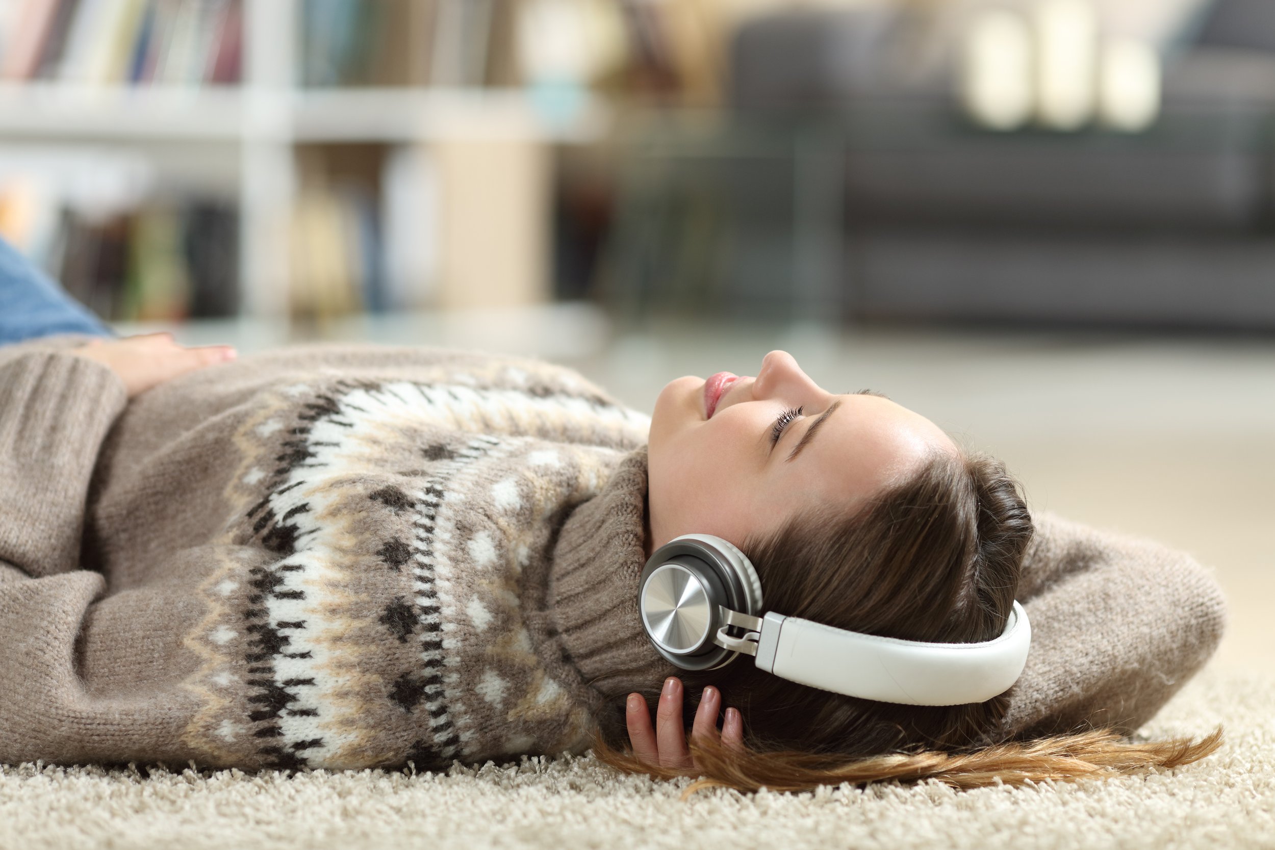 Lady listening to music with warm underfloor heating floor