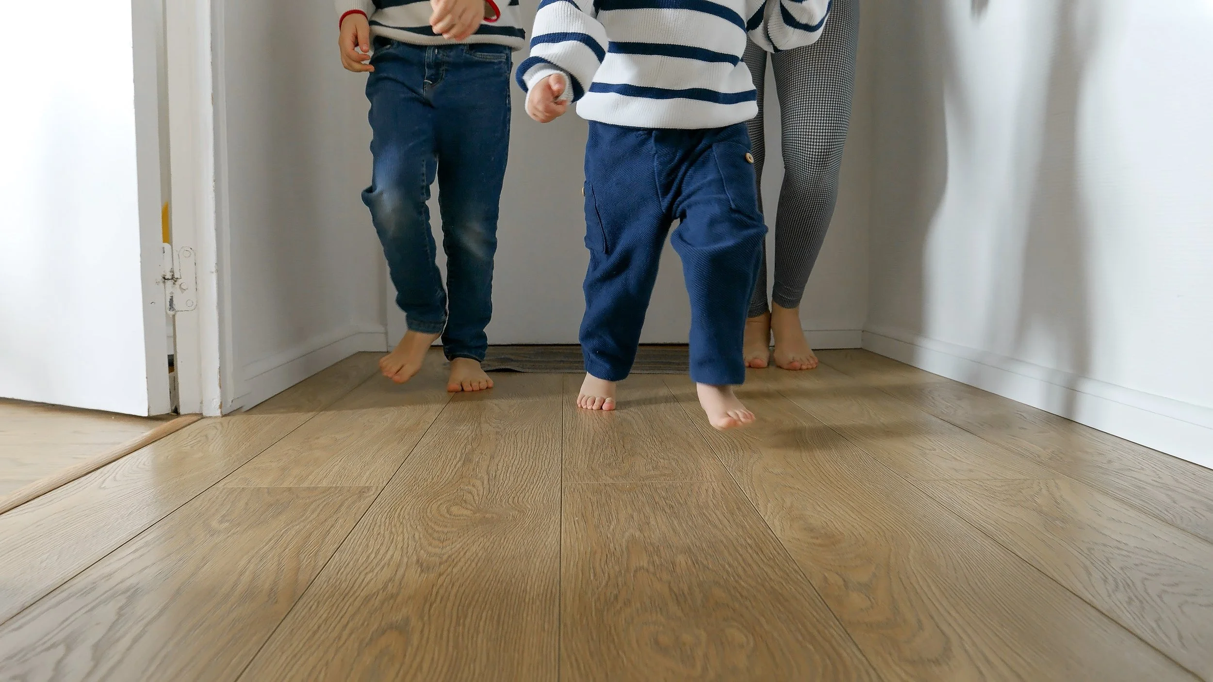 Children running barefoot in the home after boiler service and unvented cylinder repair