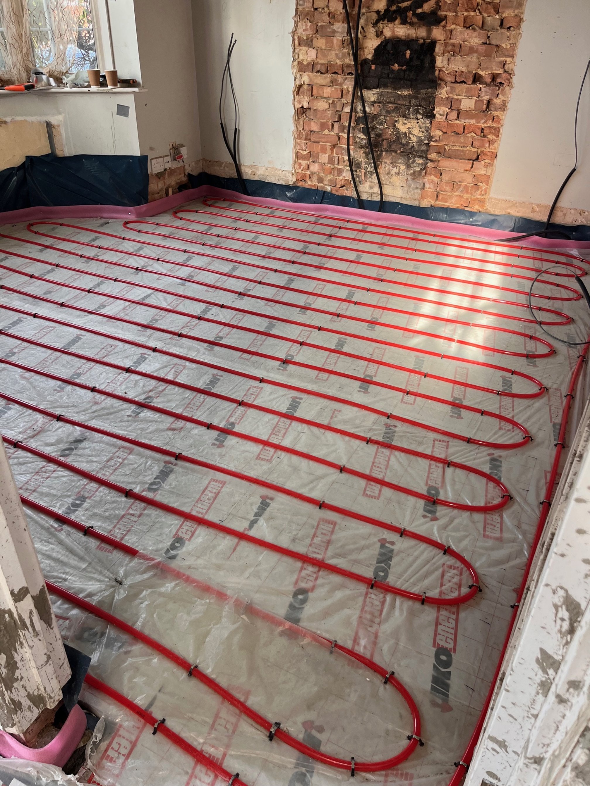 Underfloor heating installation in Bastead