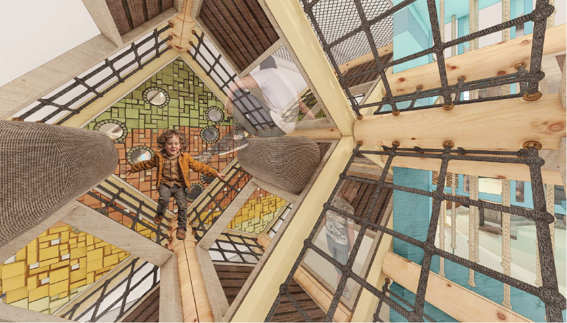 Child playing in a multi-level indoor playground with colorful climbing structures and wooden platforms from below.