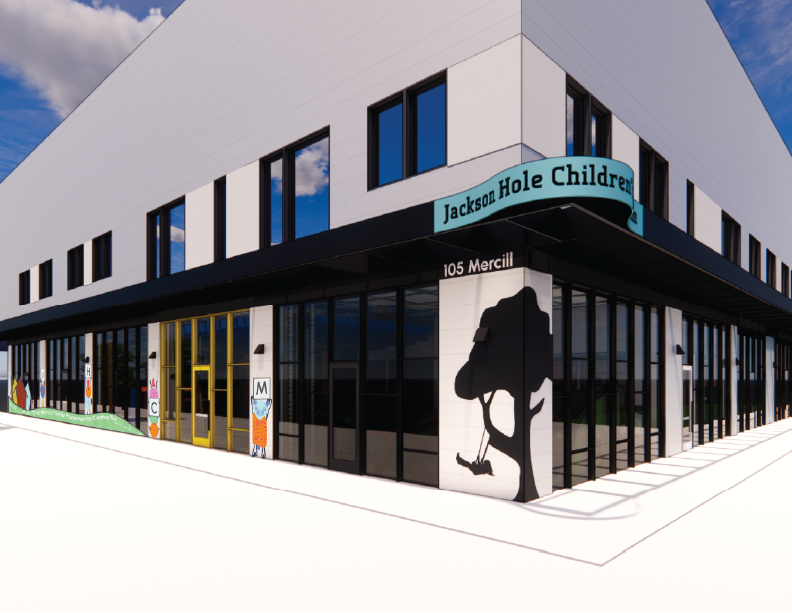 Exterior view of Jackson Hole Children's health center at 105 Merrill, with a modern white and black building, colorful alphabet-themed decorations, and a silhouette of a tree shadow on the wall.