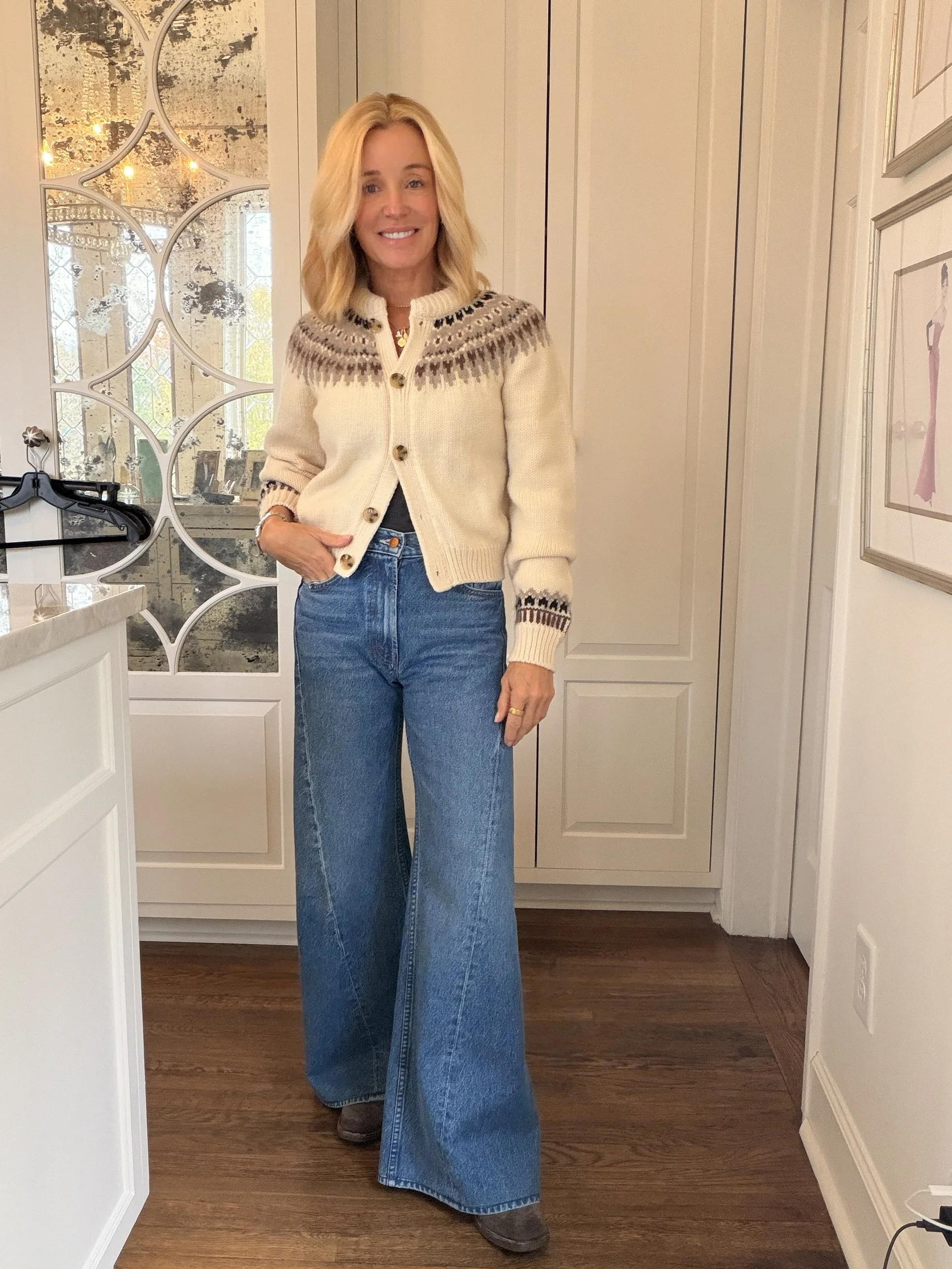 Deanna in a cream Fair Isle cardigan, Lemon Twist wide-leg jeans and suede boots