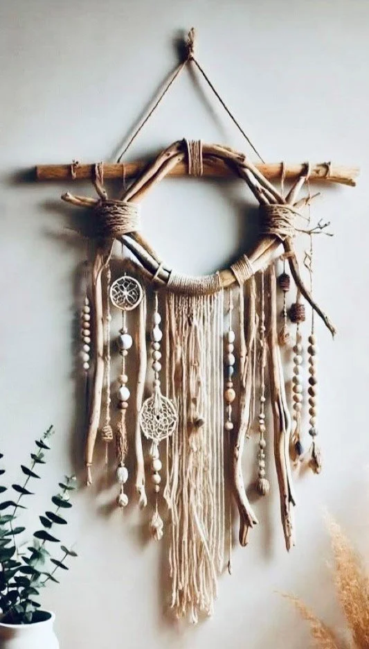 Wood and feather wall hanging