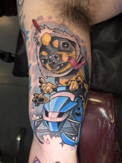 Cute dog on a Snowmobile Tattoo