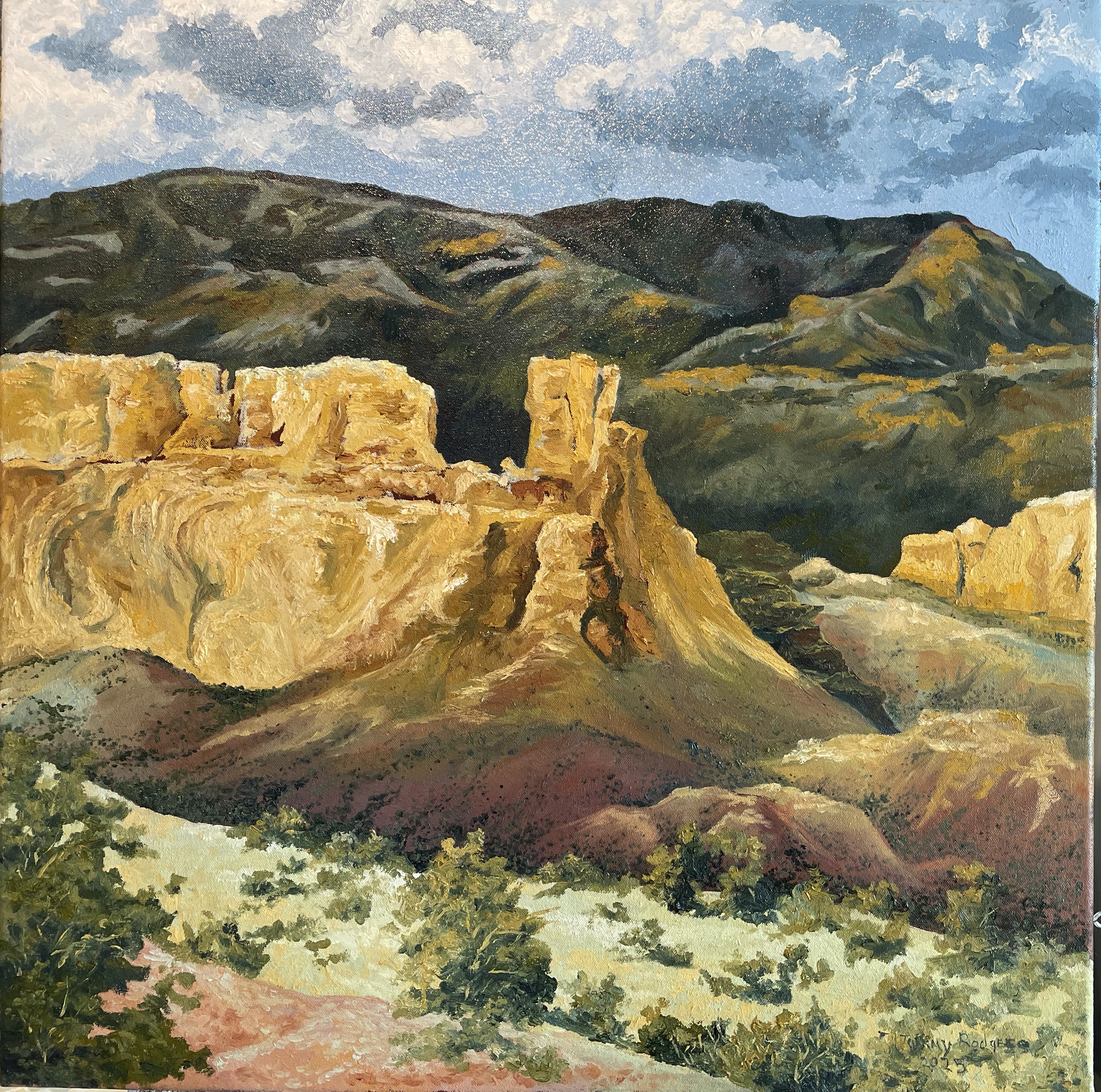 A landscape painting depicting a mountainous scene with rocky cliffs in the foreground, rolling hills in the middle ground, and a blue sky with clouds in the background.