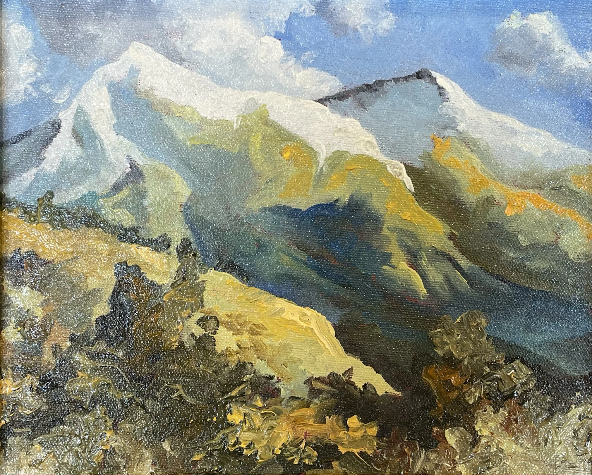 Close-up of a landscape oil painting depicting mountains under a partly cloudy sky with vibrant yellow foliage in the foreground.
