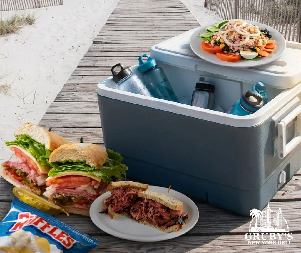 bronxed lunch and cooler on beach