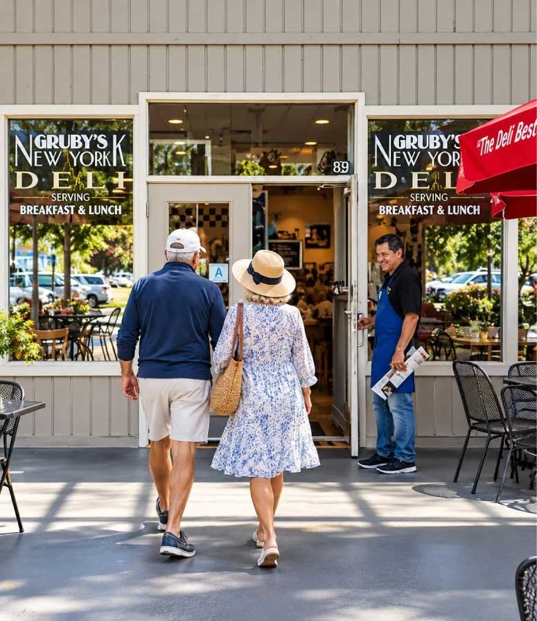 nicely dressed snowbird couple walks into Gruby's for breakfast
