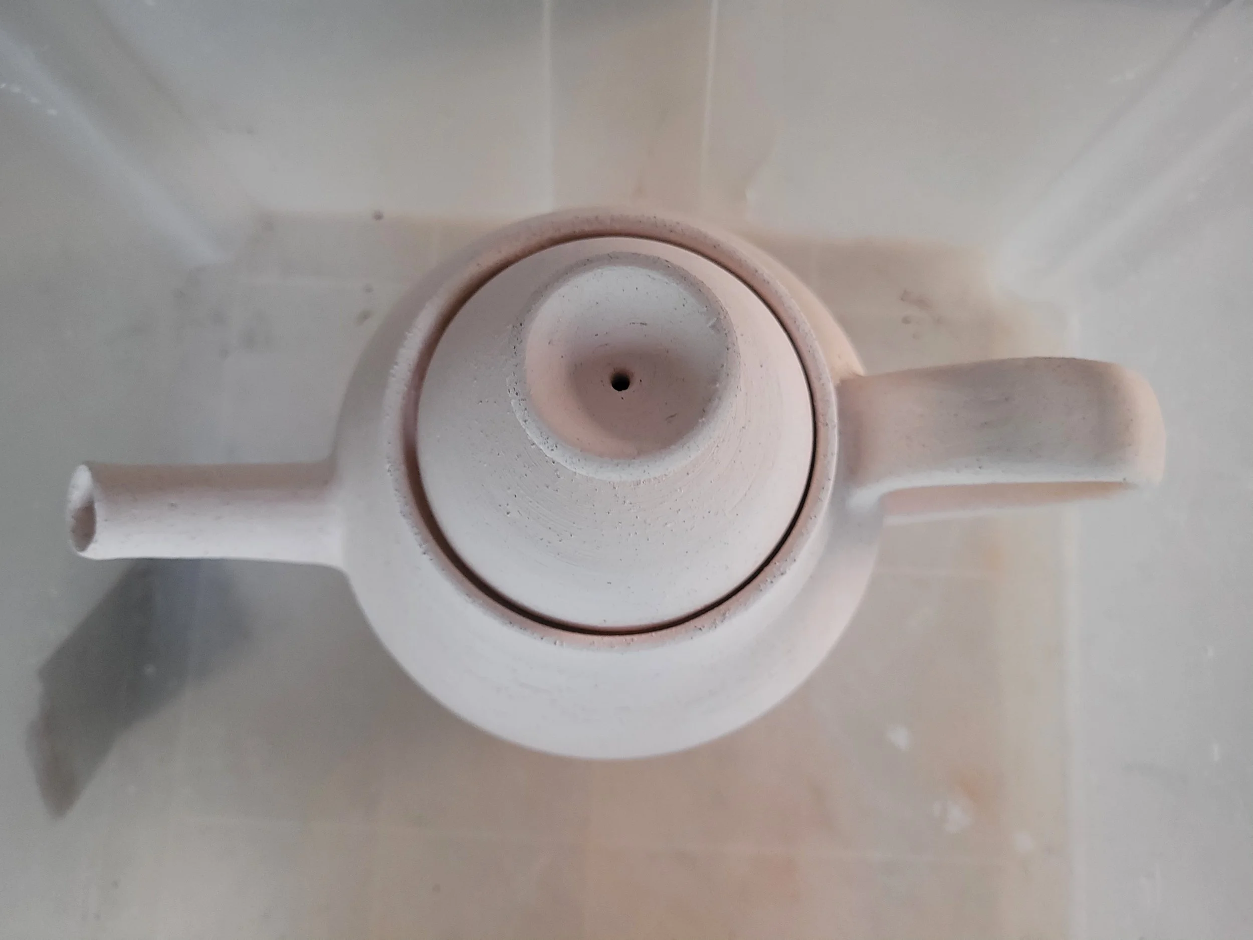 2 bisqued teapots