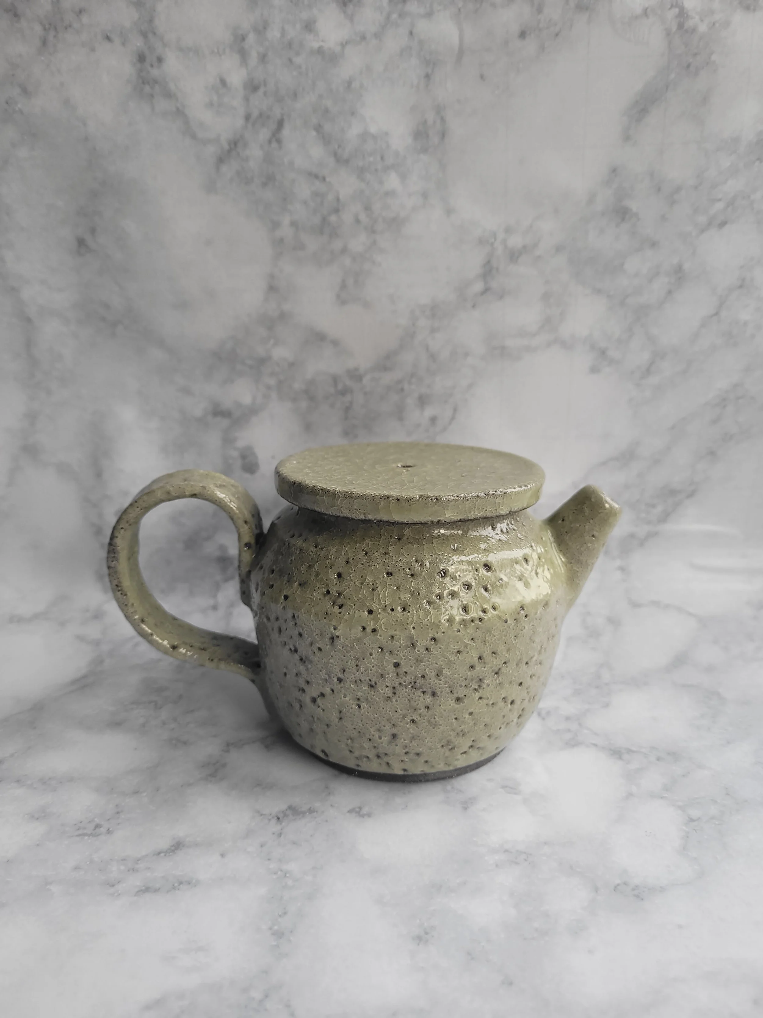 8 oz  Moss Green small teapot-outer body of teapot not a smooth glaze. 

 Click  on Image to see  Oops-Pottery.