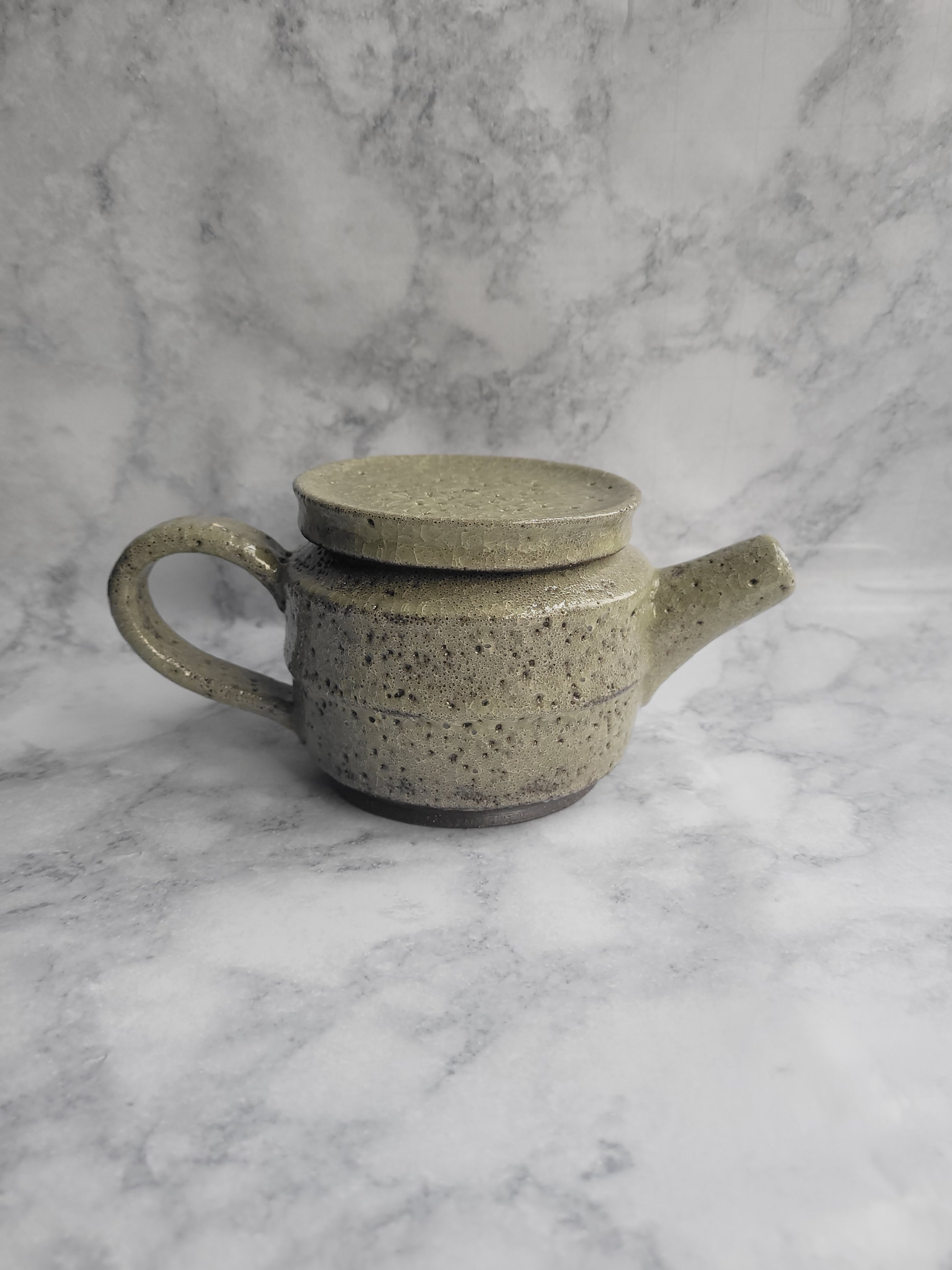 12 oz Moss Green Medium teapot-outer body of Teapot not a smooth glaze. 

 Click  on Image to see  Oops-Pottery.
