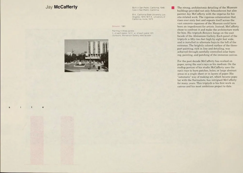 Black and white photograph of a modern architectural building with tall vertical structures, and an outdoor plaza with sculptures and steps, taken during daytime.