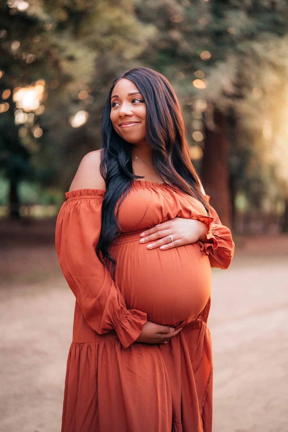 Maternity portrait at golden hour, Orange County beach session
