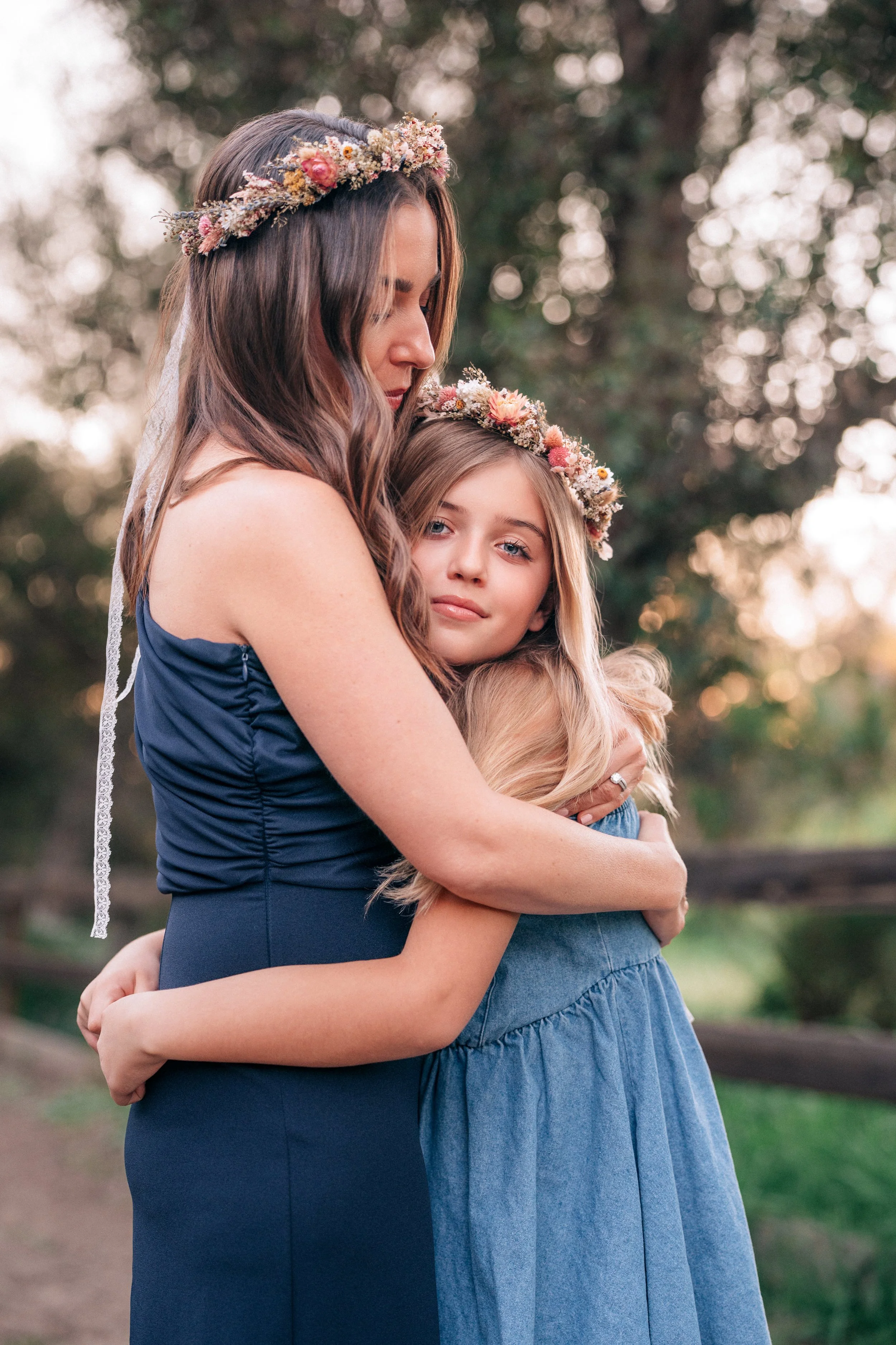 Mother and daughter hugging wearing flower crowns — Orange County family photography by Wesley D