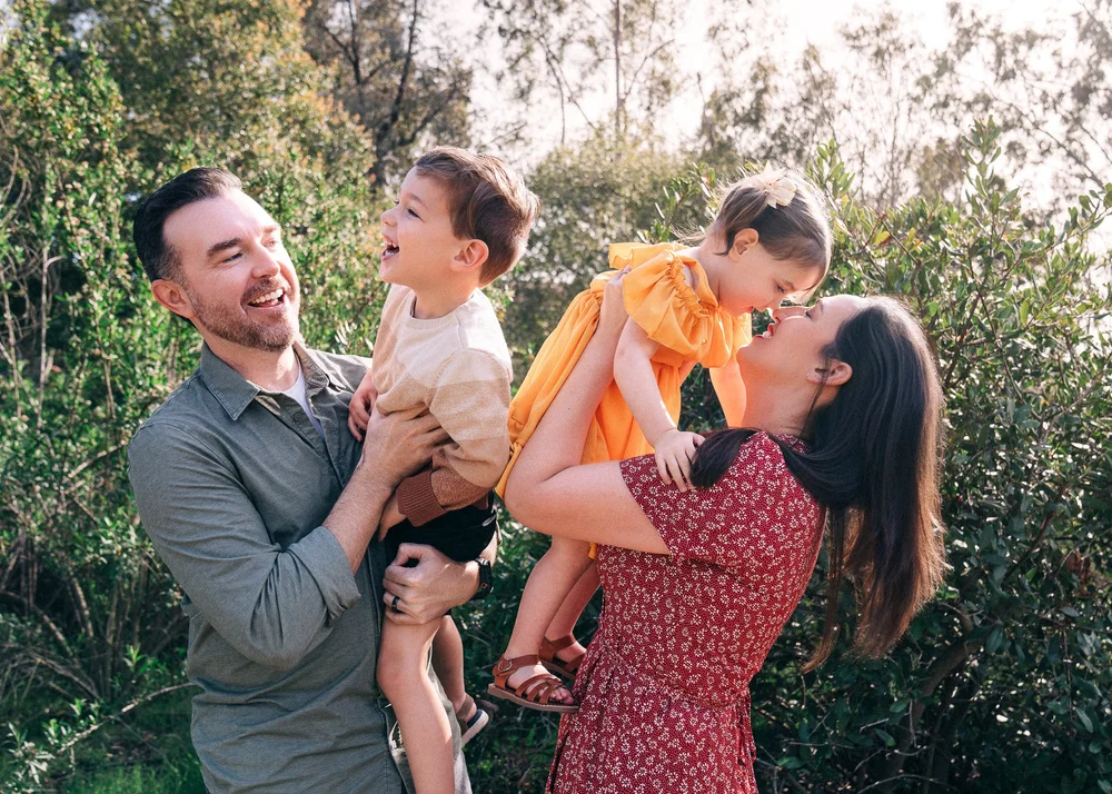 The Leon family laughing together