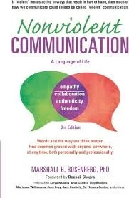 Book cover titled 'Nonviolent Communication: A Language of Life' by Marshall B. Rosenberg, PhD, featuring a speech bubble with words like empathy, collaboration, authenticity, and freedom.