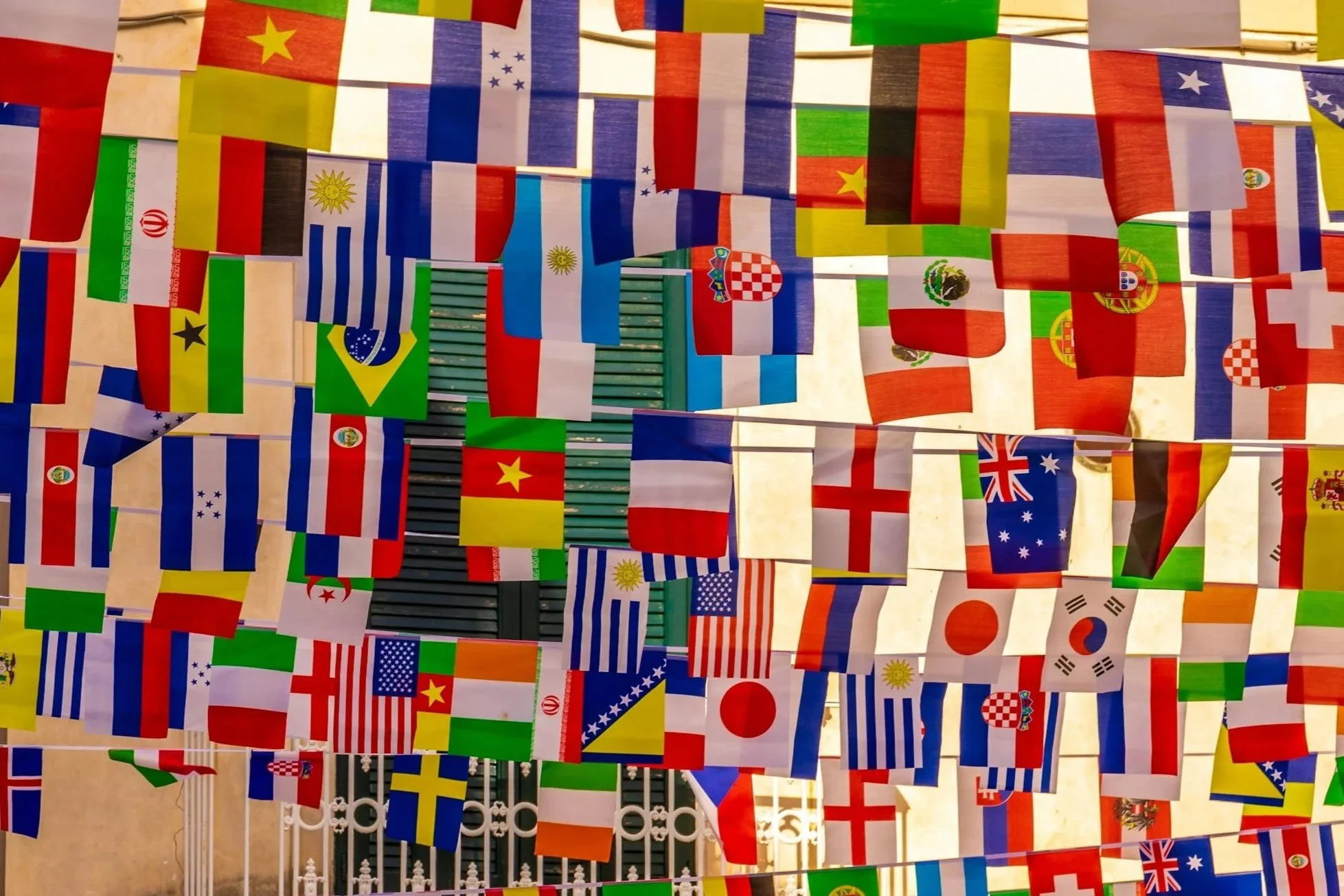 A large array of various national flags hanging as decorations.