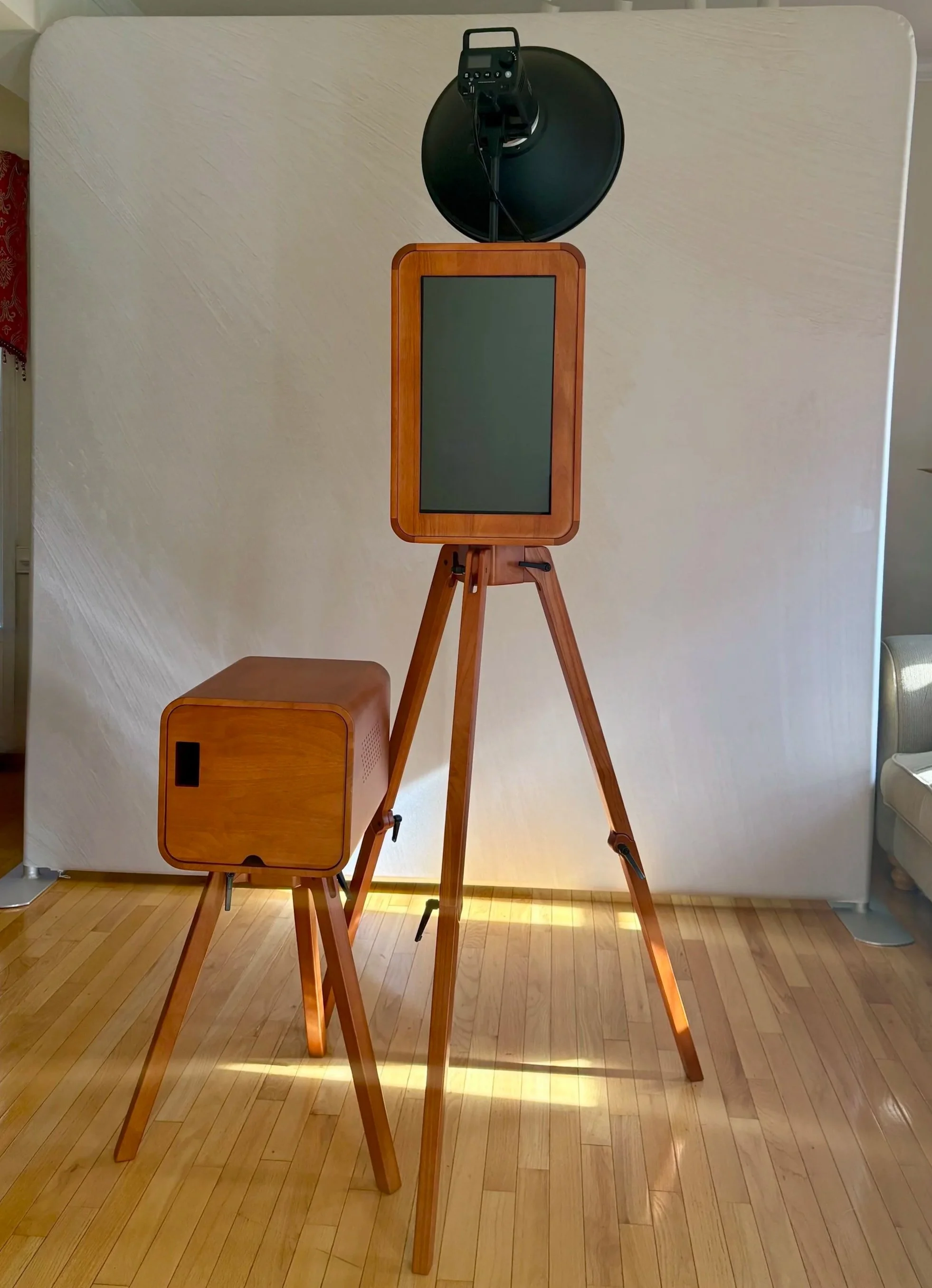 A luxurious wooden photobooth with a matching printer stand