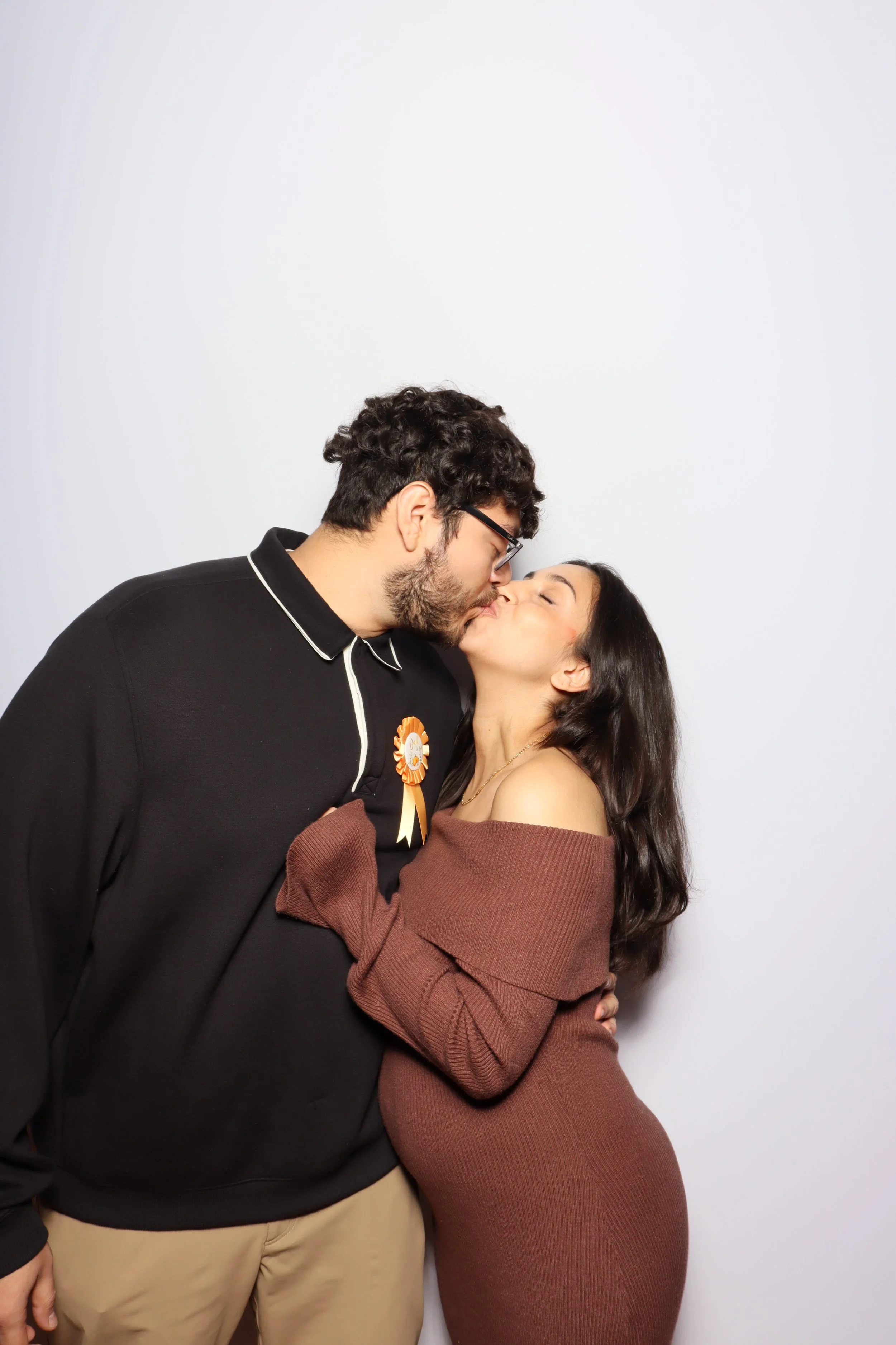 A couple kissing captured by the premium photobooth rental