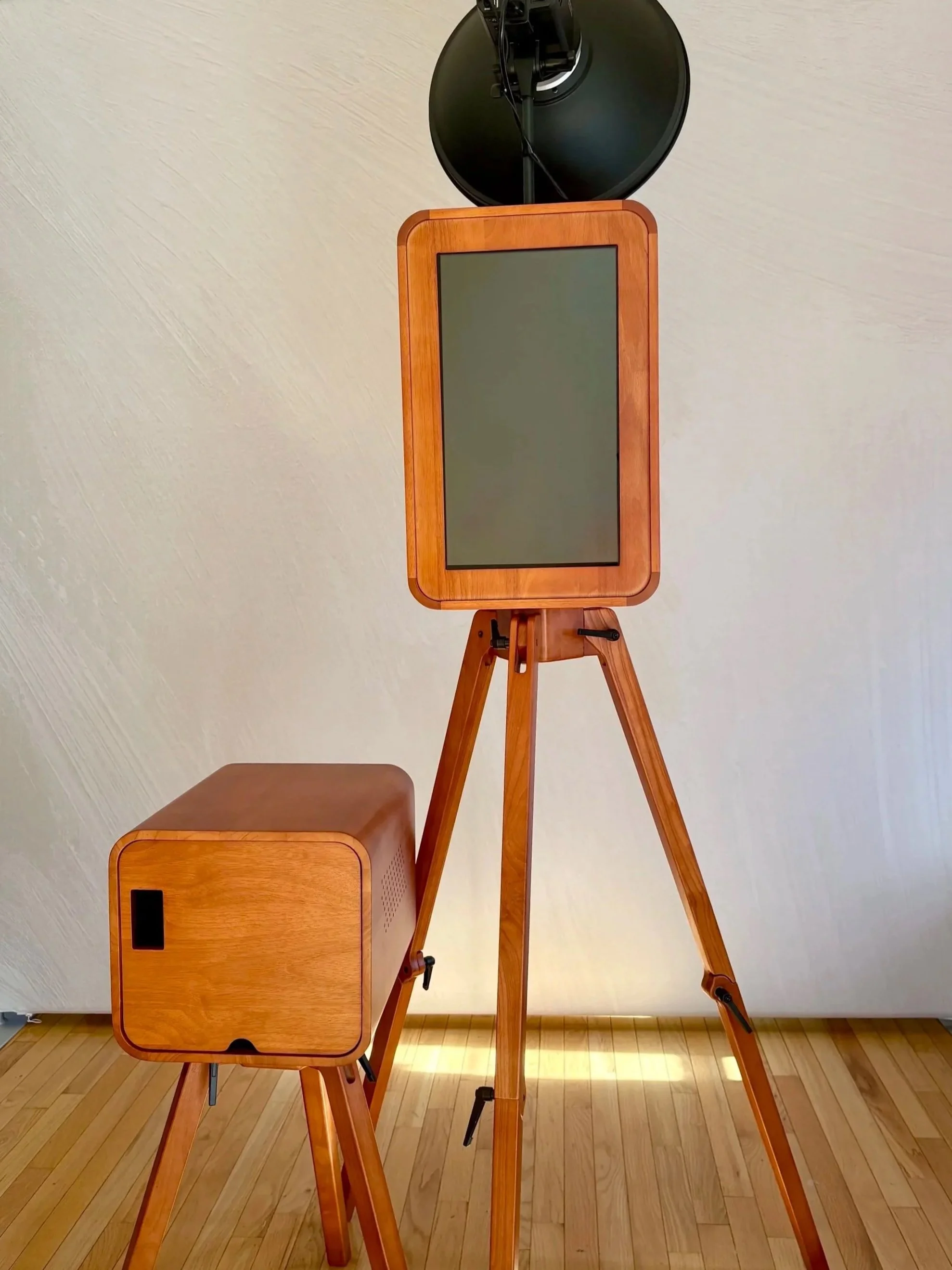 A luxurious vintage wooden photobooth design with printer stand