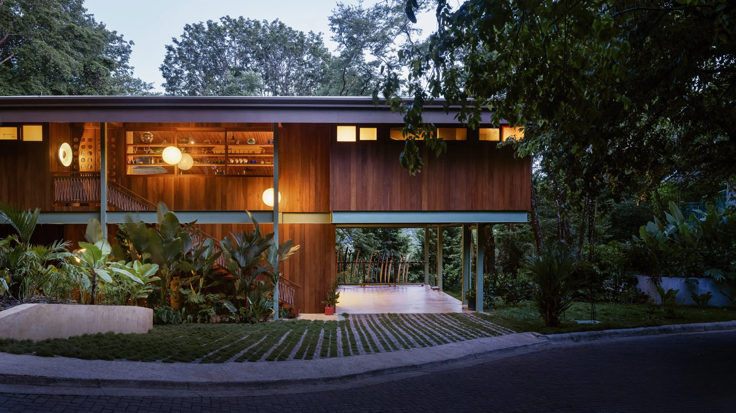 Al Suave House wooden exterior in Santa Teresa, Costa Rica, timber-clad house among tropical trees, FAMM Arquitectura