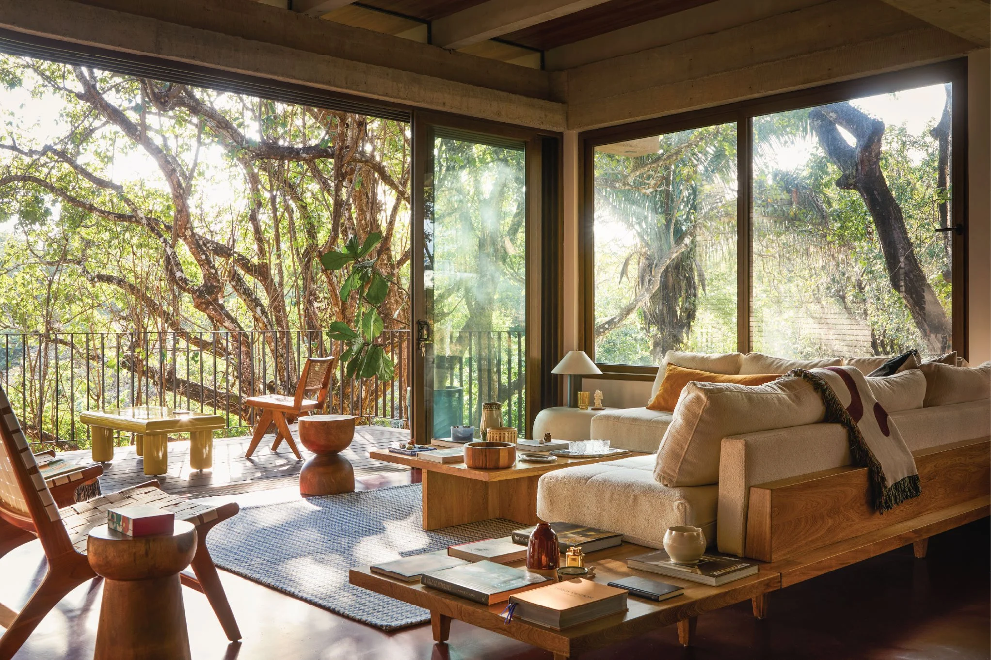 Tres Pochotes House living room by FAMM Arquitectura — open living space with full-height glazing framing the jungle canopy, Costa Rica