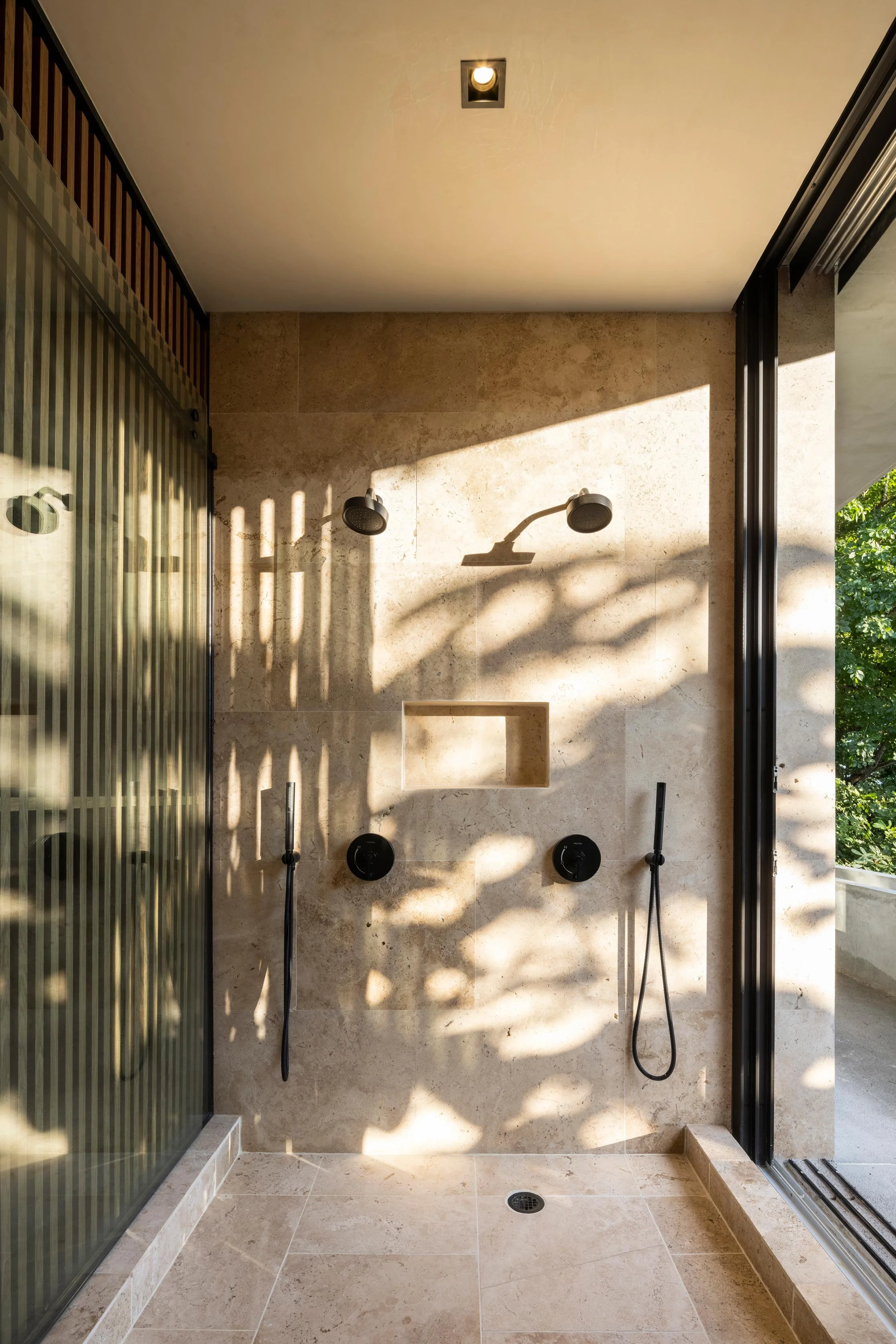 Casa Jungla shower in Santa Teresa, Costa Rica, with stone walls and timber screen, by FAMM Arquitectura