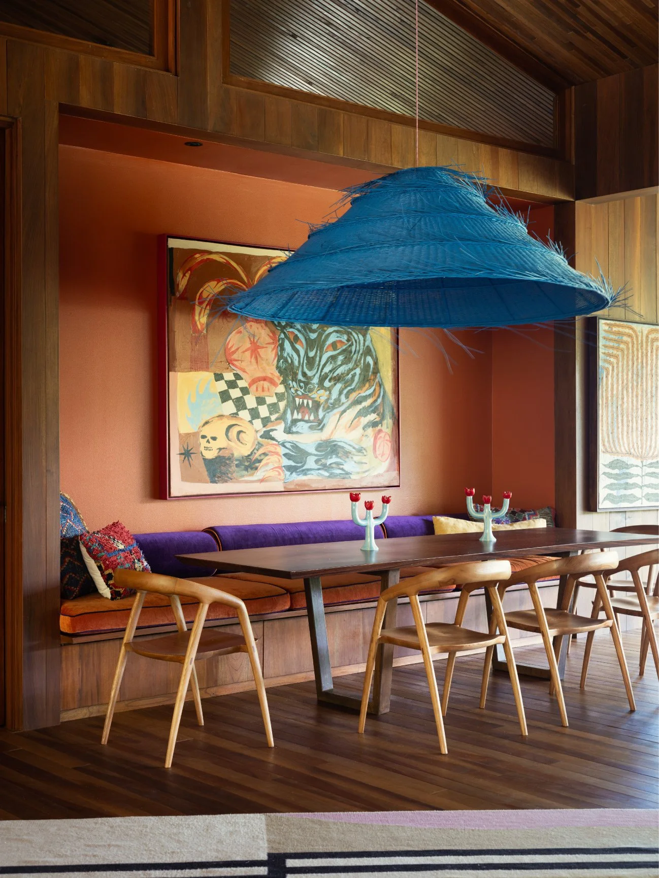 Al Suave House dining nook with blue woven pendant, purple bench and terracotta wall, FAMM Arquitectura