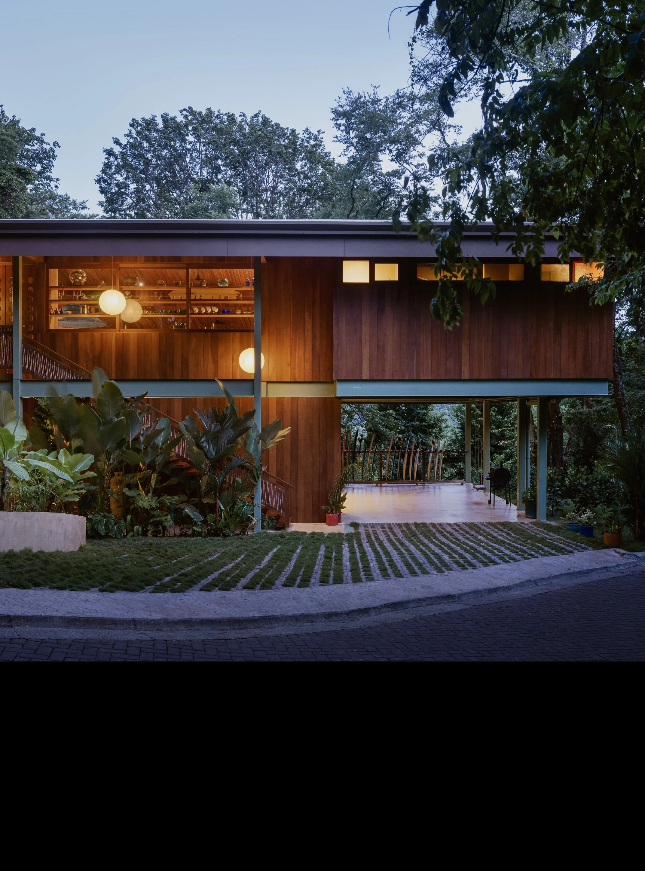 Al Suave House wooden exterior in Santa Teresa, Costa Rica, timber-clad house among tropical trees, FAMM Arquitectura