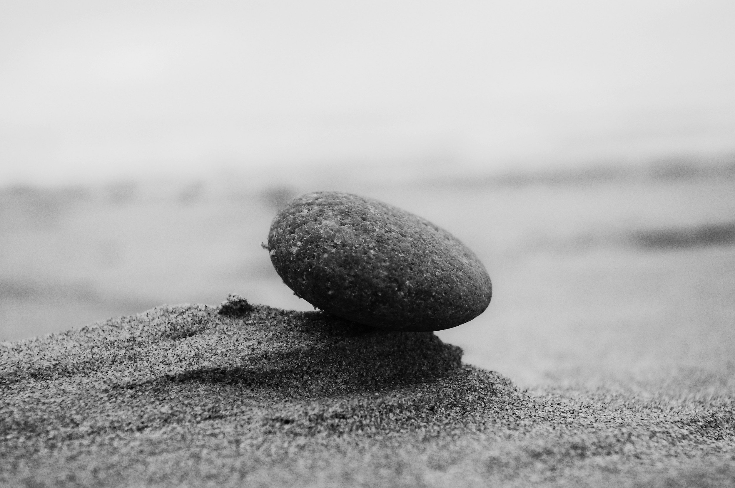 A smaller stone representing a child beginning their journey.