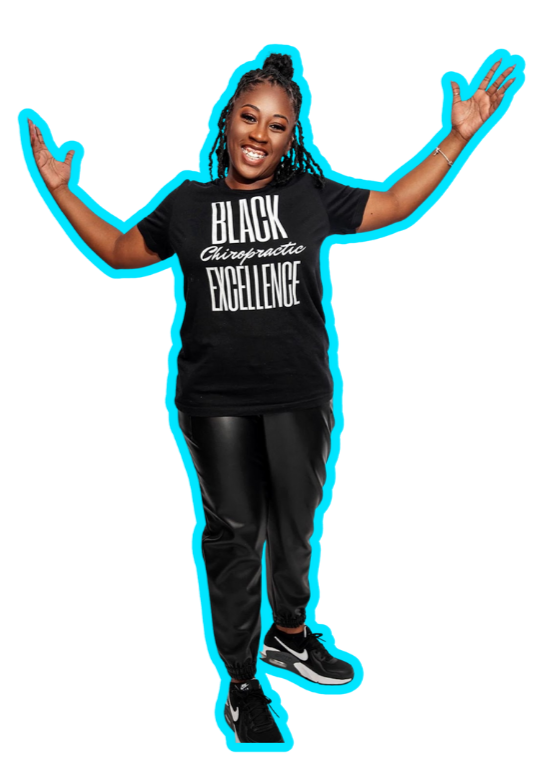 A smiling African American woman with braided hair, wearing a black T-shirt and black athletic pants, standing with arms outspread, celebrating.
