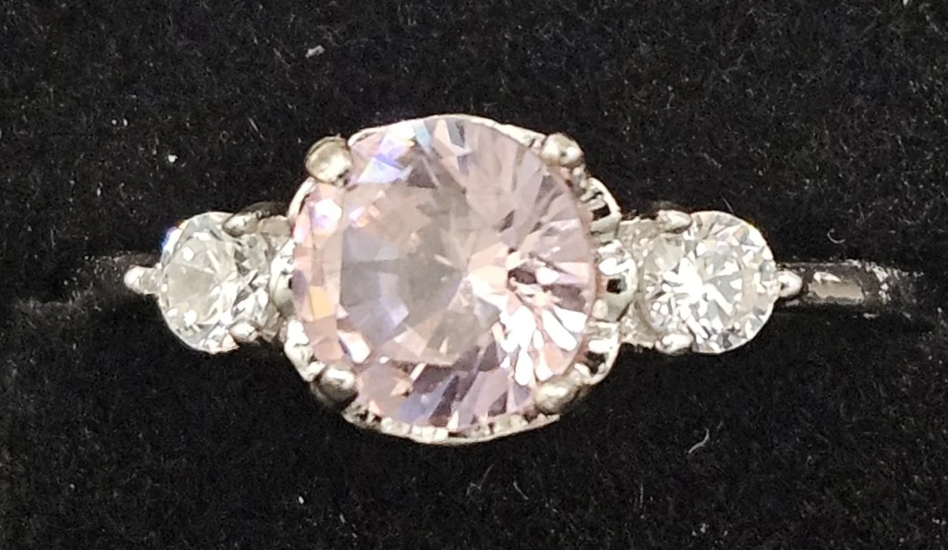 Pink cubic zirconia 6mm round stone. 925 silver adjustable ring.