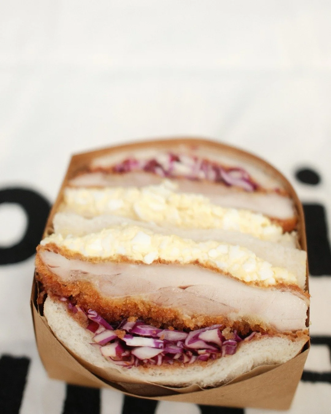 Can&rsquo;t decide between the Katsu or the Egg Salad? We made it easy.

Introducing the Konbini Club Sando: Our two icons in one frame. Crispy, golden panko-crusted chicken meets our signature silky egg salad, all tucked into pillowy shokupan.

It&r