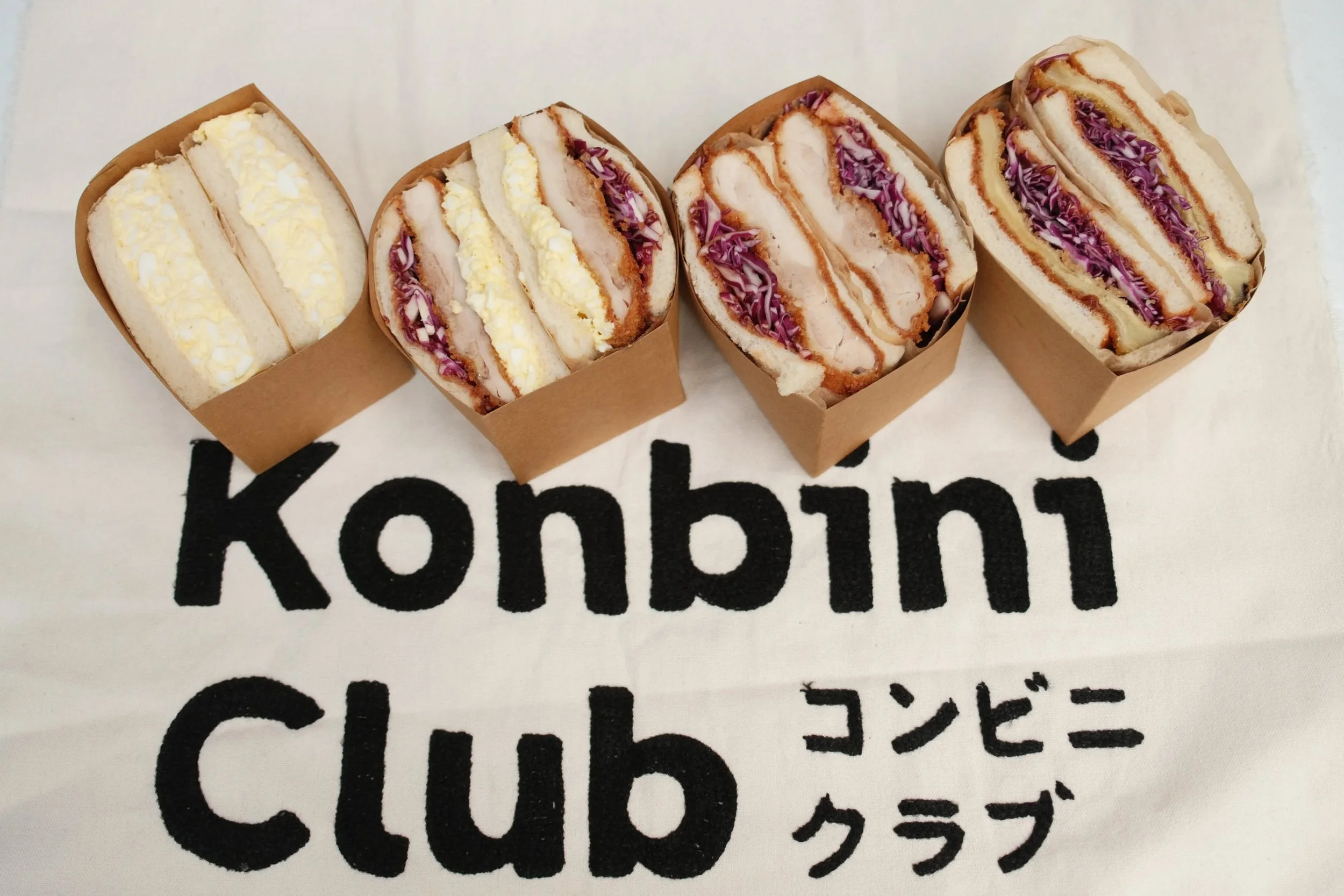 The sandwiches we couldn&rsquo;t stop thinking about after trips to Japan.

Soft milk bread.
Creamy egg salad.
Crispy katsu.
A little messy in the best way.

Konbini Club started from a love for the comfort foods found in Japanese convenience stores,