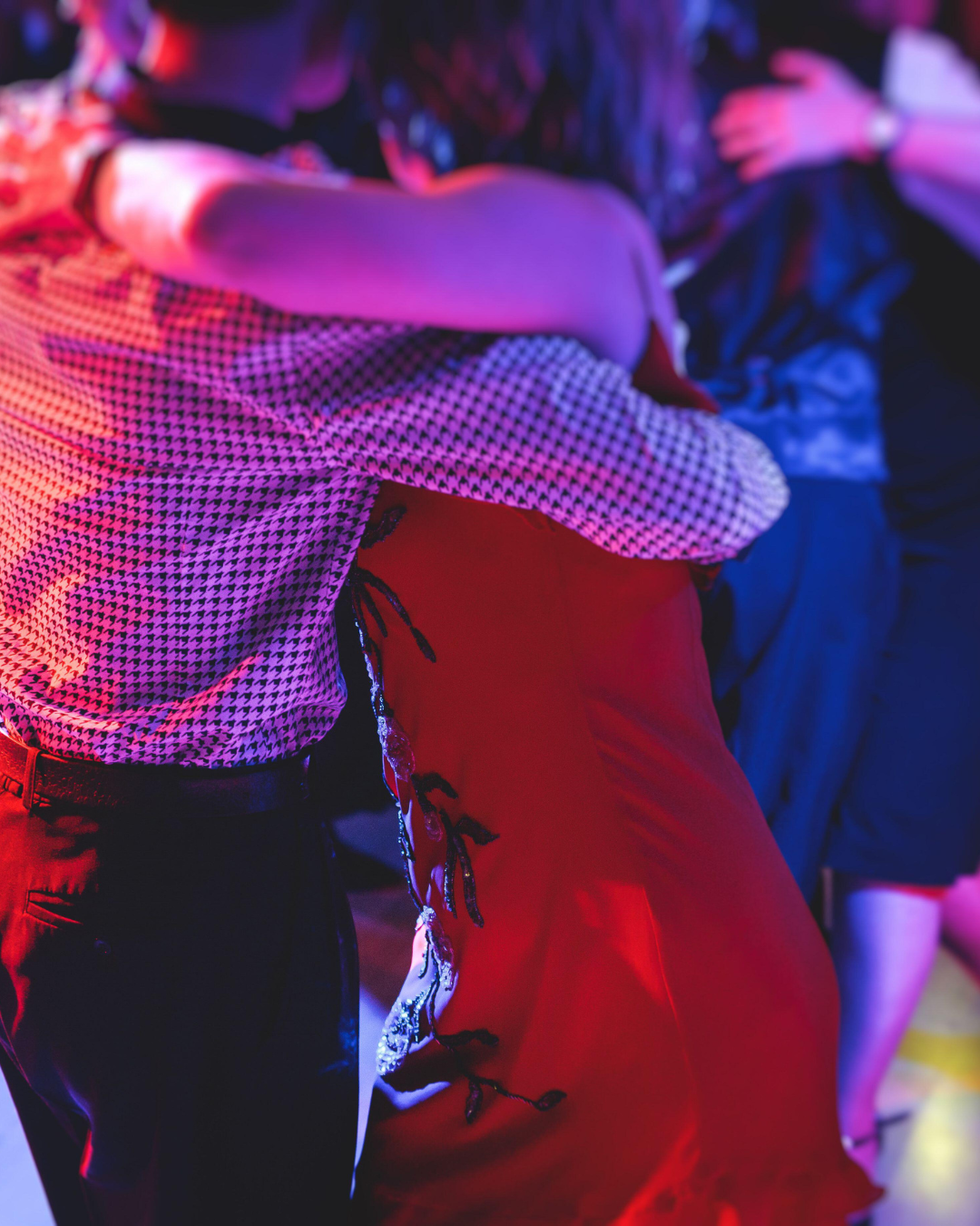 couple dancing bachata in nightclub