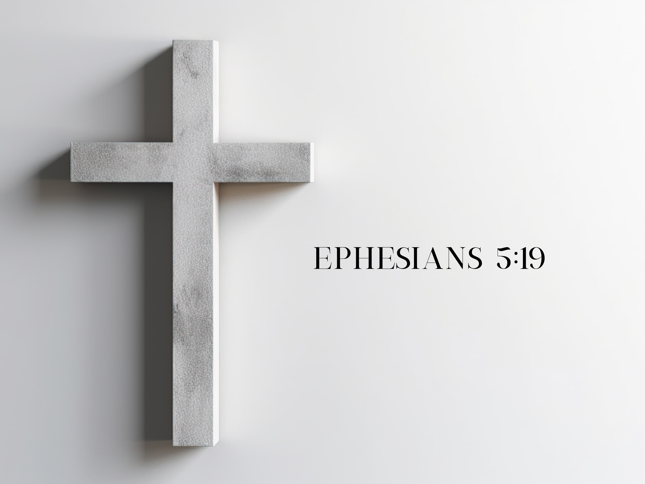 A gray cross on a white background with the Bible verse 'Ephesians 5:19' written beside it.