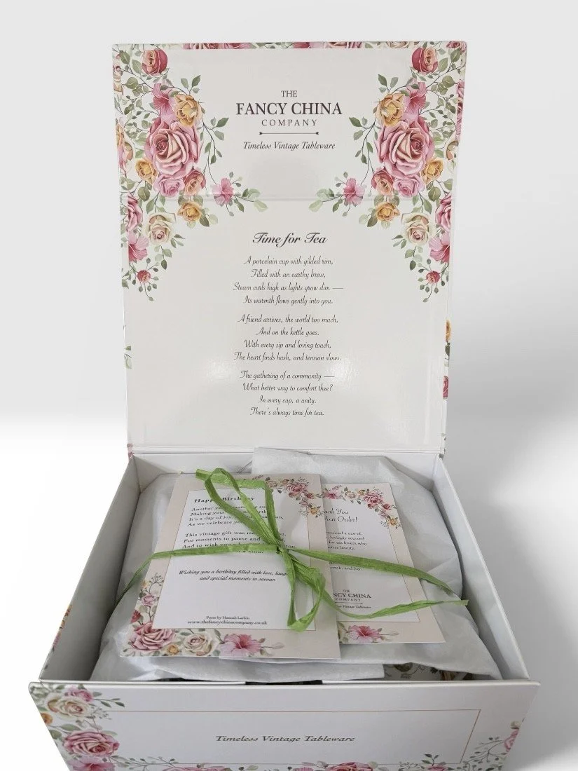 closed white box with green ribbon.jfif