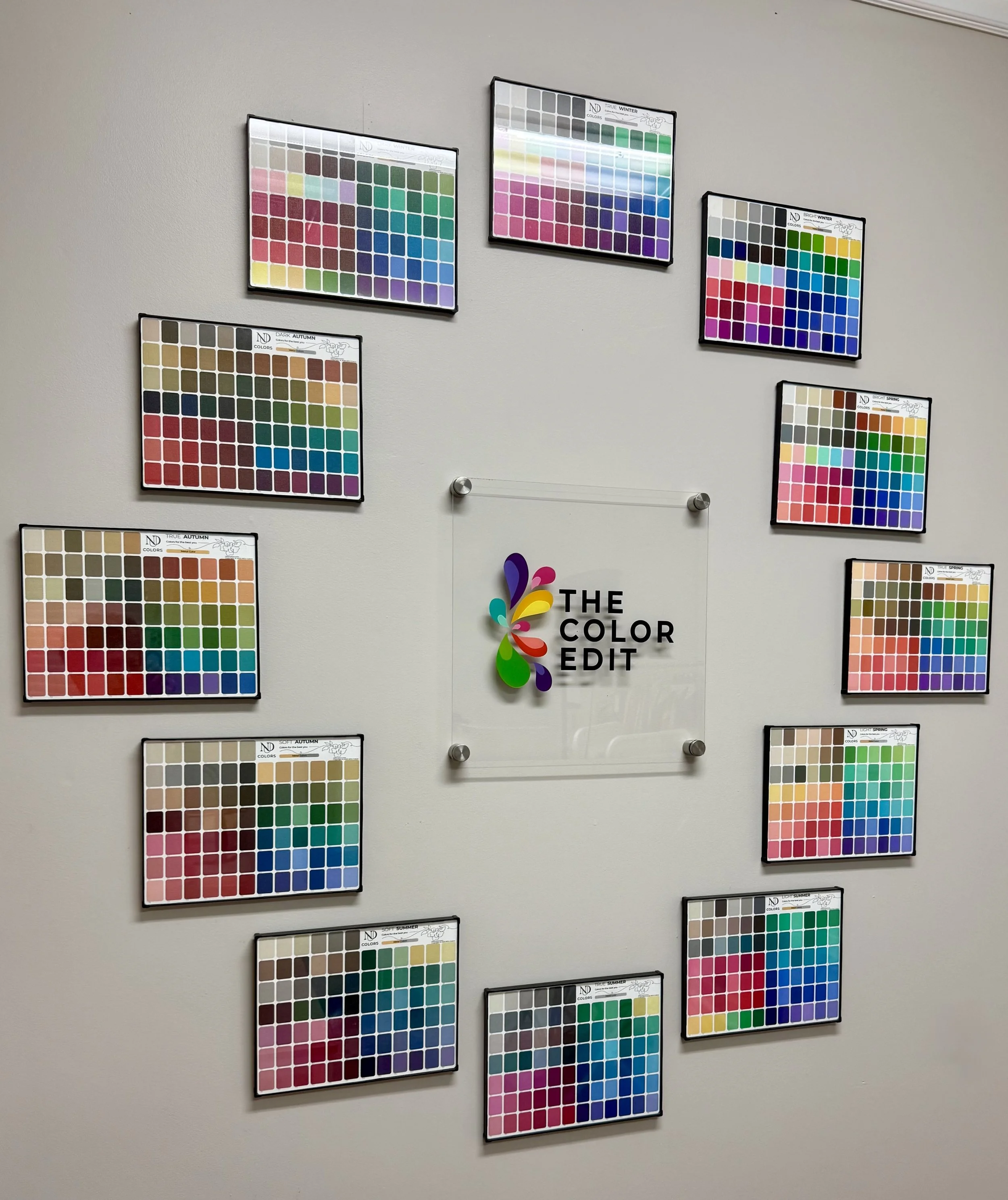 Color palettes of all 12 seasons surrounding The Color Edit sign