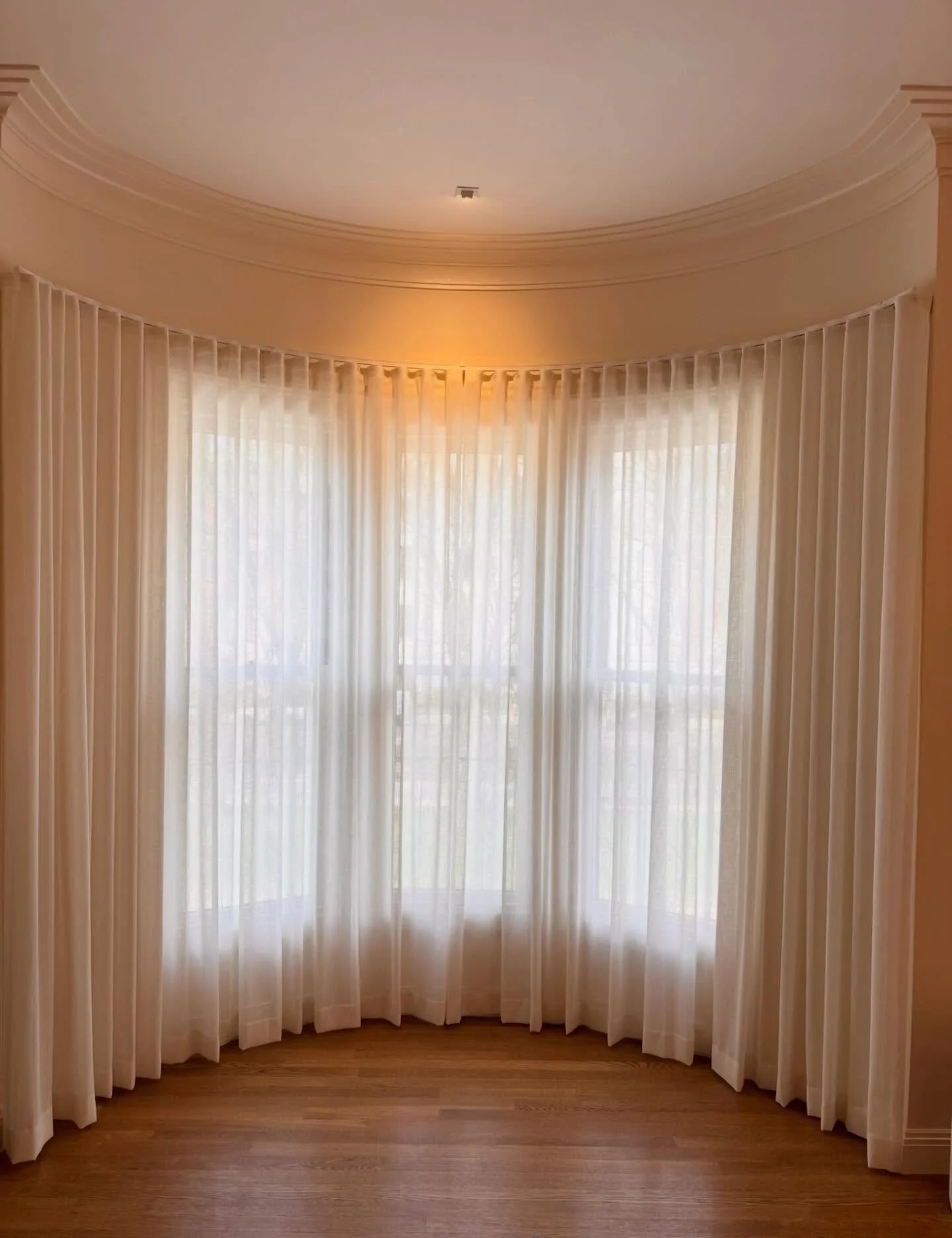 Beautiful sheers on a curved track plus an action shot of the installation process!