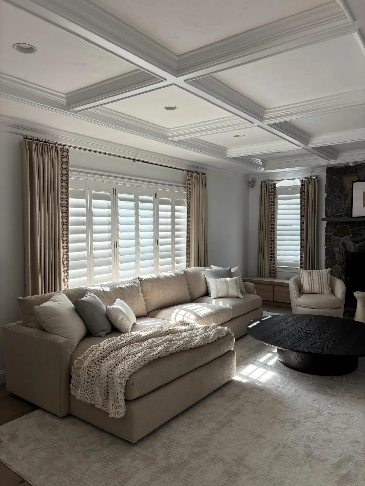 These beautiful drapes with edge banding really tie everything together in this cozy fireplace area! #drapery #design