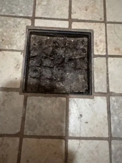 inspection showing buildup and blockage before drain cleaning