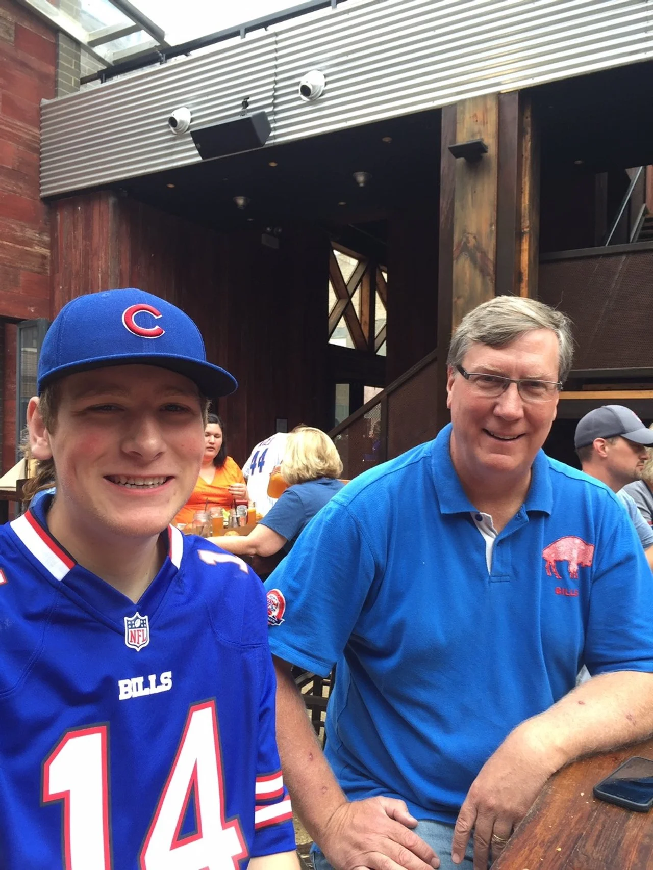 photo of Michael Brindley with his Dad at a sporting event